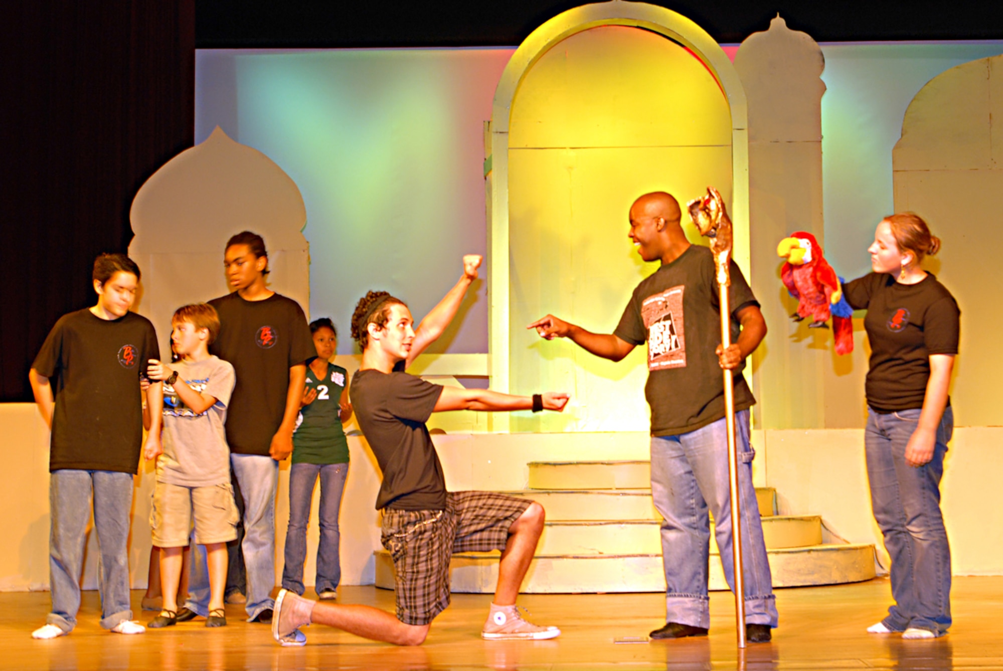 Senior Airman Jamaal Solomon (second from the right), 18th Logistic Readiness Squadron, reads a scroll that will determine who Princess Jasmine will marry during a rehearsal of Disney’s “Aladdin Jr.”
(U.S. Air Force photo by Airman 1st Class Kasey Zickmund)