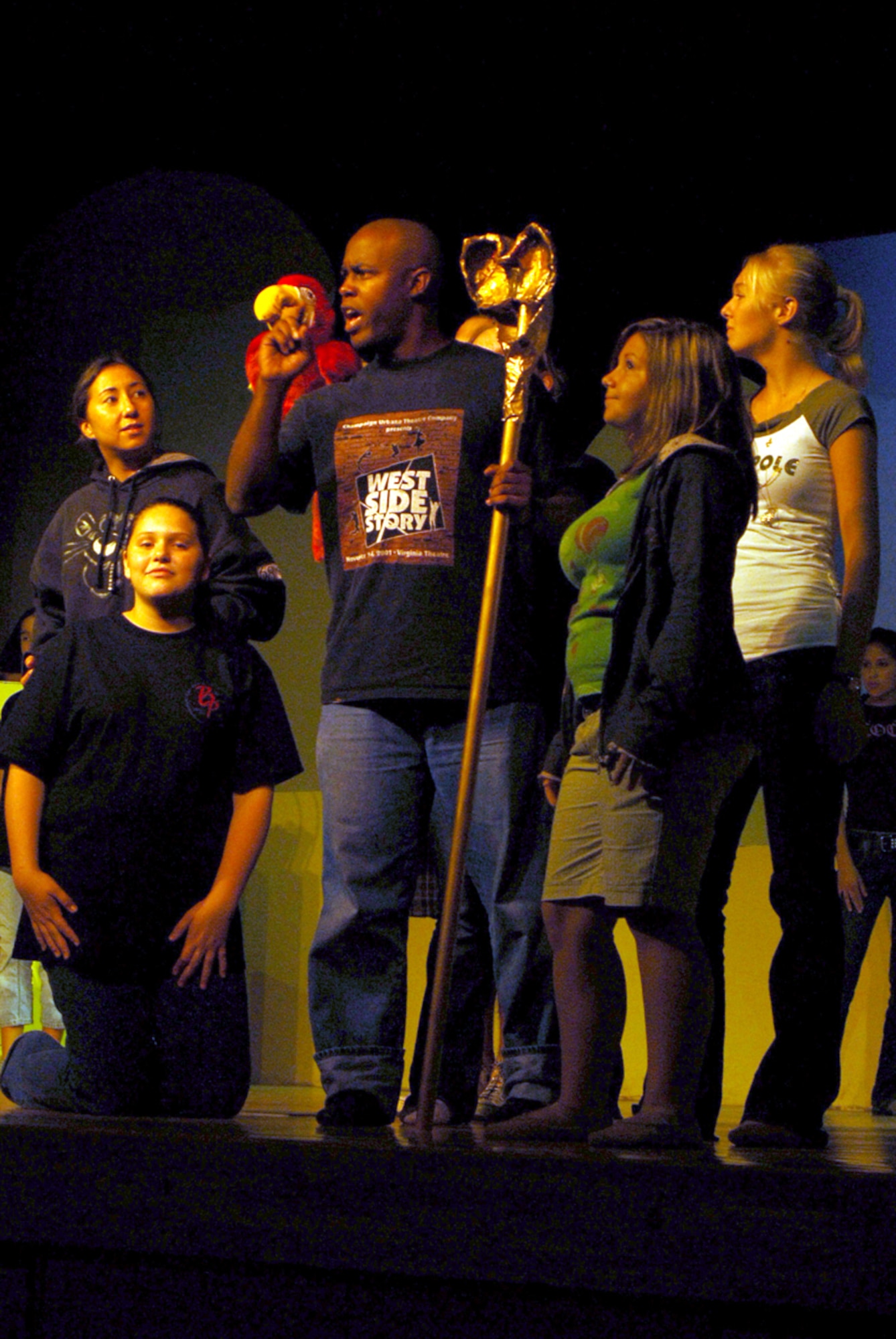 Senior Airman Jamaal Solomon (center), 18th Logistic Readiness Squadron, sings a song with fellow cast members around him during a rehearsal of Disney’s “Aladdin Jr.”
(U.S. Air Force photo/Airman 1st Class Kasey Zickmund)
