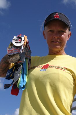 Eberle Funches, wife of Senior Airman Neal Funches, 320th Special Tactics Squadron, displays the medals she earned from various Ironman triathlons. She is the only triathlete on Okinawa to compete in 10 Ironman races. Her latest race was Ironman Louisville in Kentucky.
(U.S. Air Force/Senior Airman Nestor Cruz)