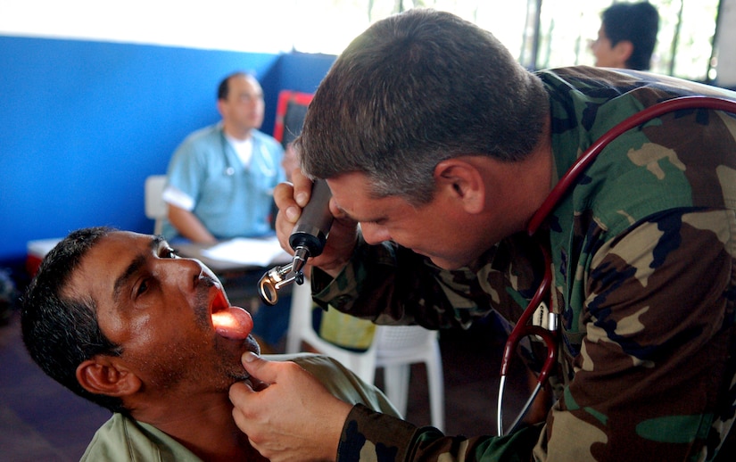 SAN JUAN OPICO, El Salvador – Air Force Capt. Michael Ceranowski, Joint Task Force-Bravo Medical Element, examines a local man’s throat at a makeshift clinic where doctors, nurses and medics from the United States and Salvadoran militaries conducted a Medical Readiness Training Exercise Sept. 27.  (U.S. Air Force photo by Staff Sgt. Austin M. May)