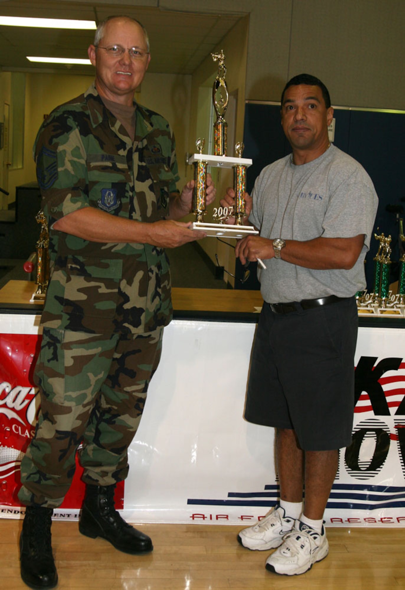 Here Senior Master Sgt. Jerry Paine, KC-135 Maintenance Manager for 4th Air Force, accepts the first place trophy, on behalf of his 4th AF team, for the March ARB “Base Golf Championship” from Mr. Marco Defelice, Recreation Assistance at the March ARB Fitness Center. This ceremony was the finale for an annual golf event held at March that began this year in April. The 4th AF team’s rival was the team from the Air Traffic Controllers, who earlier in the competition won the League Championship. (U.S. Air Force photo by Master Sgt. Wendy Weidenhamer)
