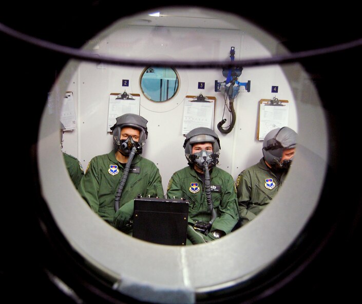 Students in a specialized Undergraduate Pilot Training class 08-12 learn what it's like to breath oxygen for an extended period of time in the altitude chamber at Laughlin AFB, Texas aerospace physiology flight. (Photo by Staff Sgt. Austin M. May)