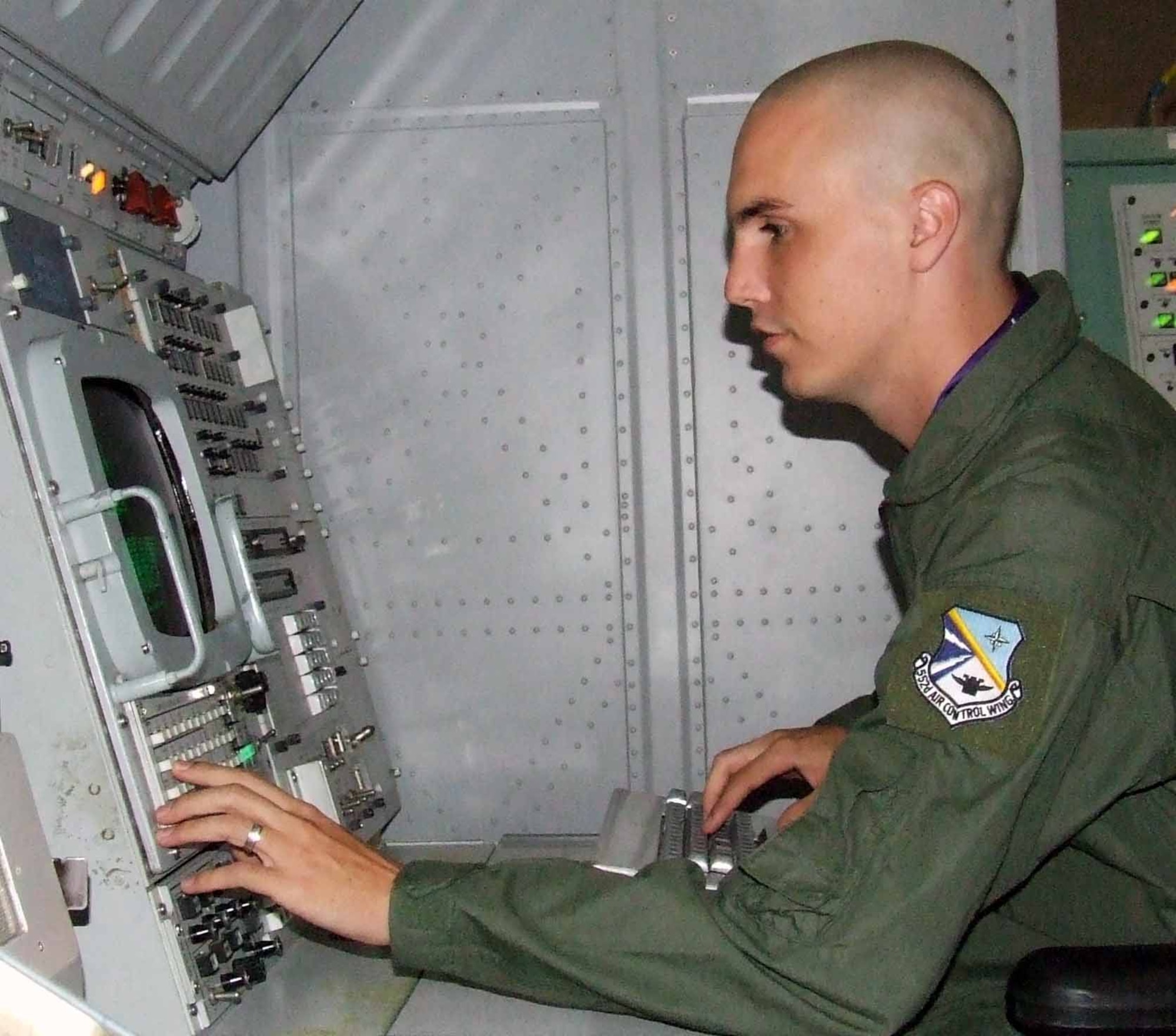 Senior Airman Tristan Zittenfield ensures the 4PI computer comes up correctly in the Facilty for Interoperability Testing. (Air Force photo)