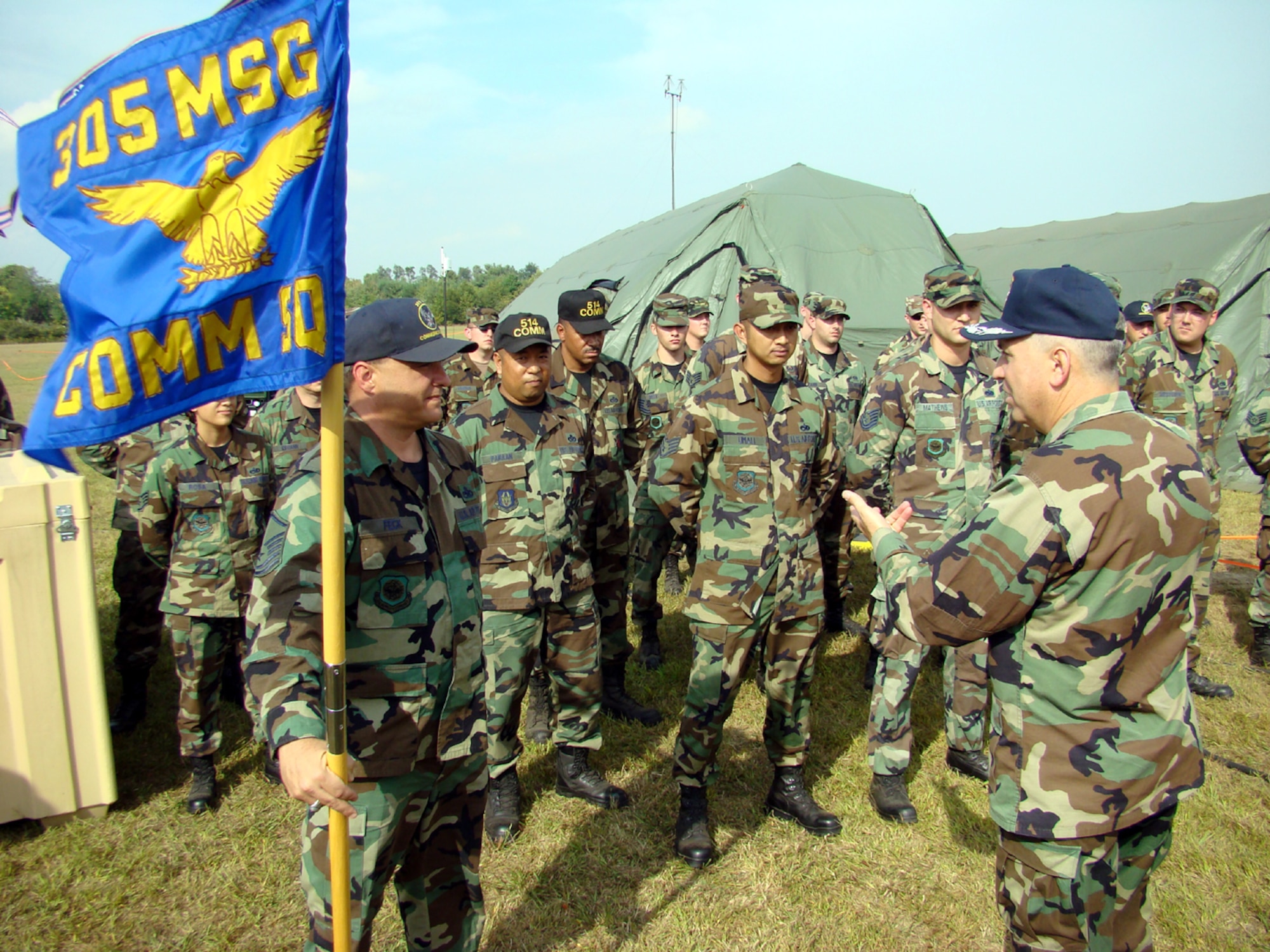 Col. Rick Martin, 305th Air Mobility Wing commander, speaks to members of the 305th Communications Squadron during his visit to different squadrons Sept. 28 here. Colonel Martin thanked everyone for their great work in supporting McGuire's mission. Colonel Martin will relinquish command to Col. Balan Ayyar, 319th Air Refueling Wing, Grand Forks Air Force Base, N.D., during a change of command ceremony here Oct. 2. (U.S. Air Force photo/Airman 1st Class Tamika Edwards)