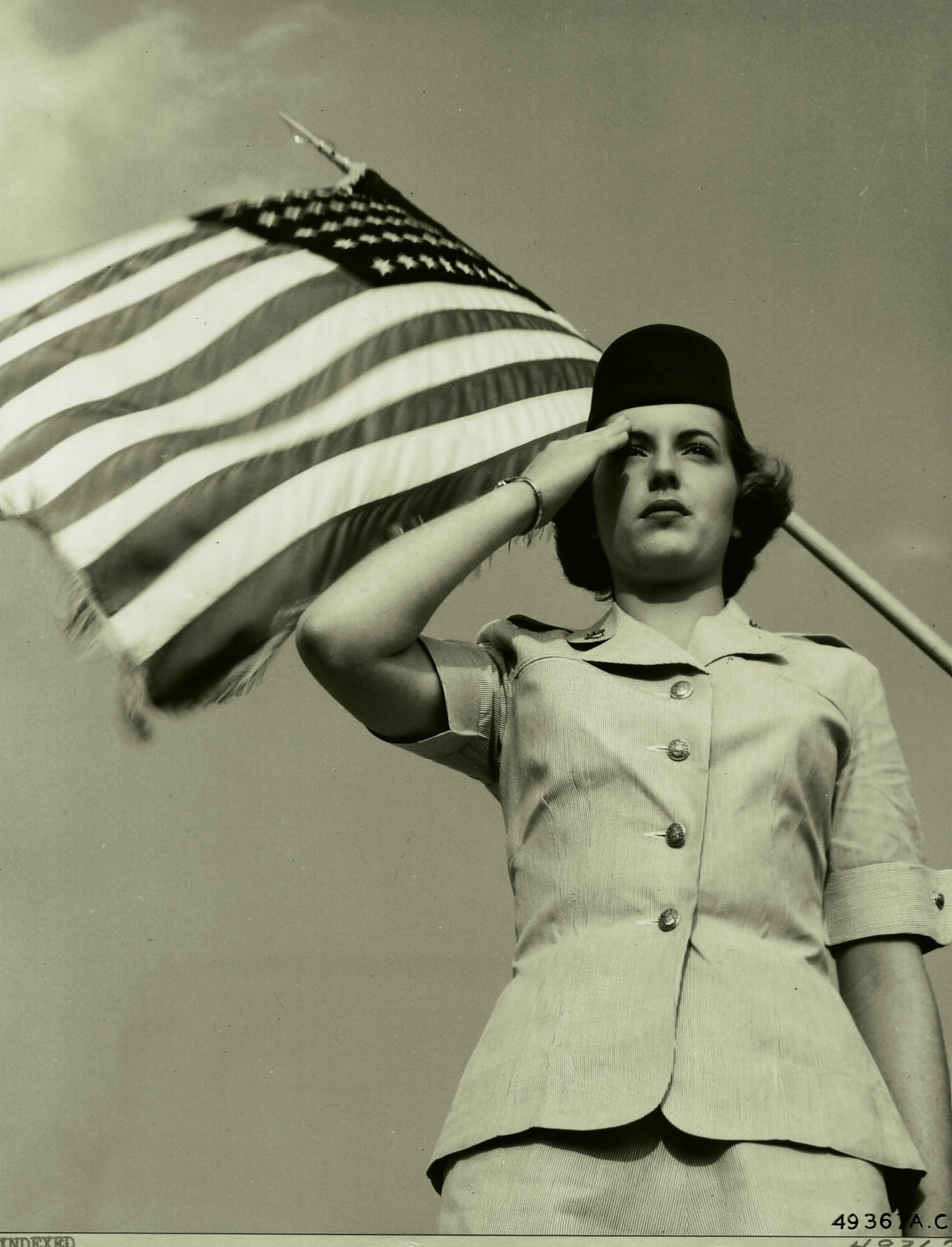 At Lackland Air Force Base, Texas, in 1952, a Woman in the Air Force officer candidate salutes proudly.  
