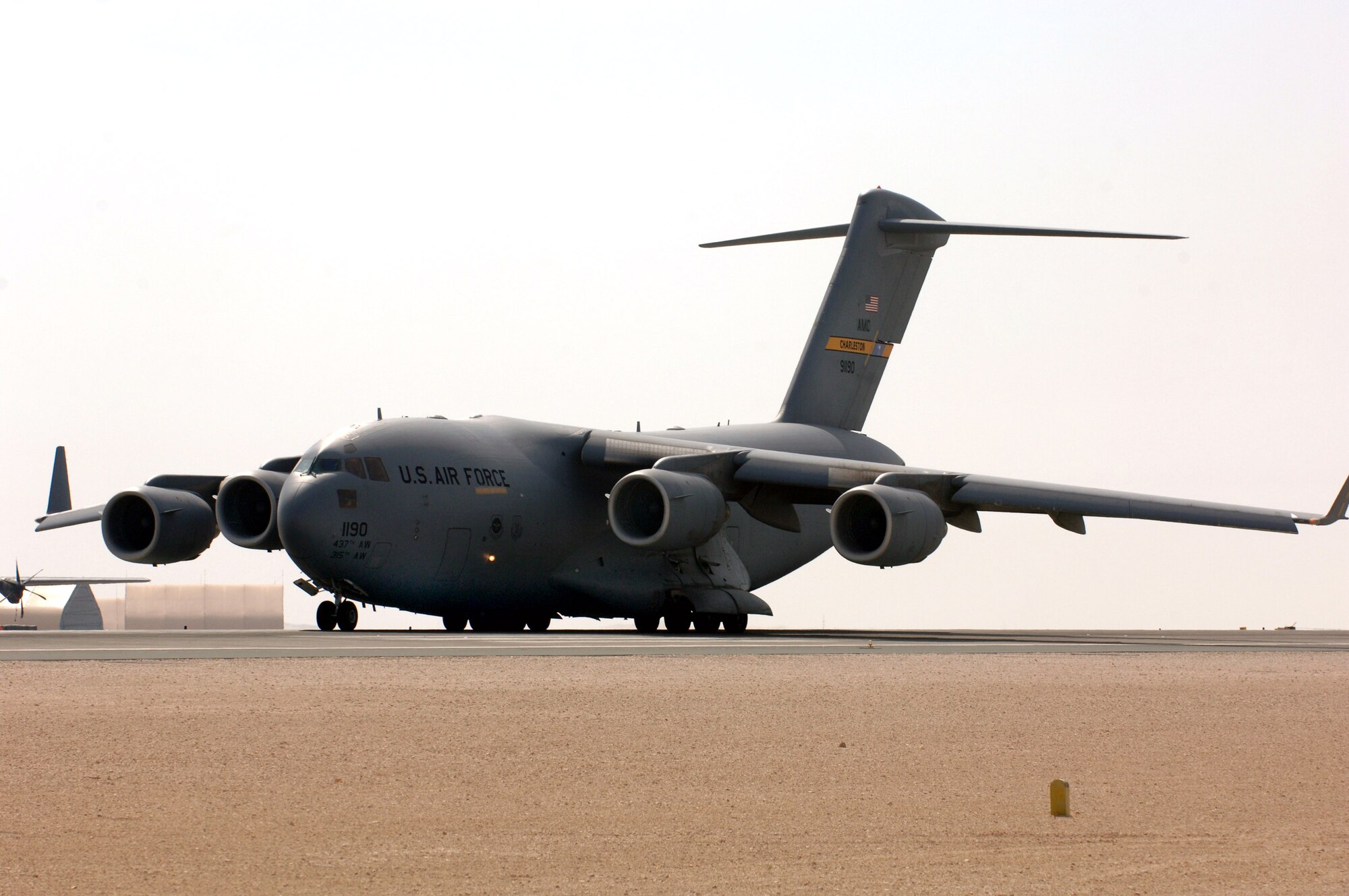A C-17 Globemaster III from Charleston AFB, prepares to take off from a deployed location in Southwest Asia.The C-17 is the newest, most flexible cargo aircraft to enter the airlift force. The C-17 is capable of rapid strategic delivery of troops and all types of cargo to main operating bases or directly to forward bases in the deployment area. The aircraft can perform tactical airlift and airdrop missions and can also transport litters and ambulatory patients during aeromedical evacuations when required. The inherent flexibility and performance of the C-17 force improve the ability of the total airlift system to fulfill the worldwide air mobility requirements of the United States. (Air Force Photo/Master Sgt. Greg Kunkle)