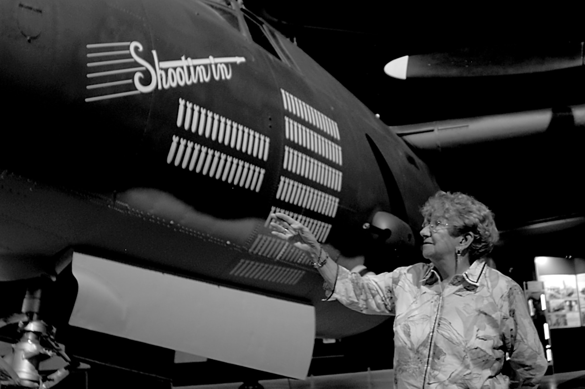 Mary Barrows views her handy work on the B-26 Marauder during a visit to the National Museum of the U.S. Air Force at Wright-Patterson Air Force Base. During World War II Barrows, at age 17, went to work for Case Manufacturing riveting together the wings of the plane.  (Robert Bardua/U.S. Air Force)