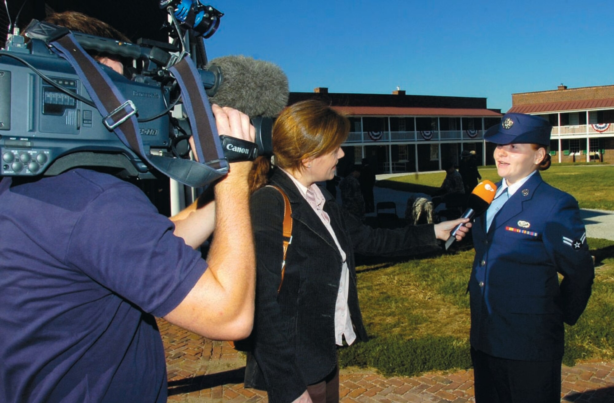 Airman Clarke participates in an interview by a German television news station about the naturalization ceremony.  (US Air Force/Bobby Jones)
