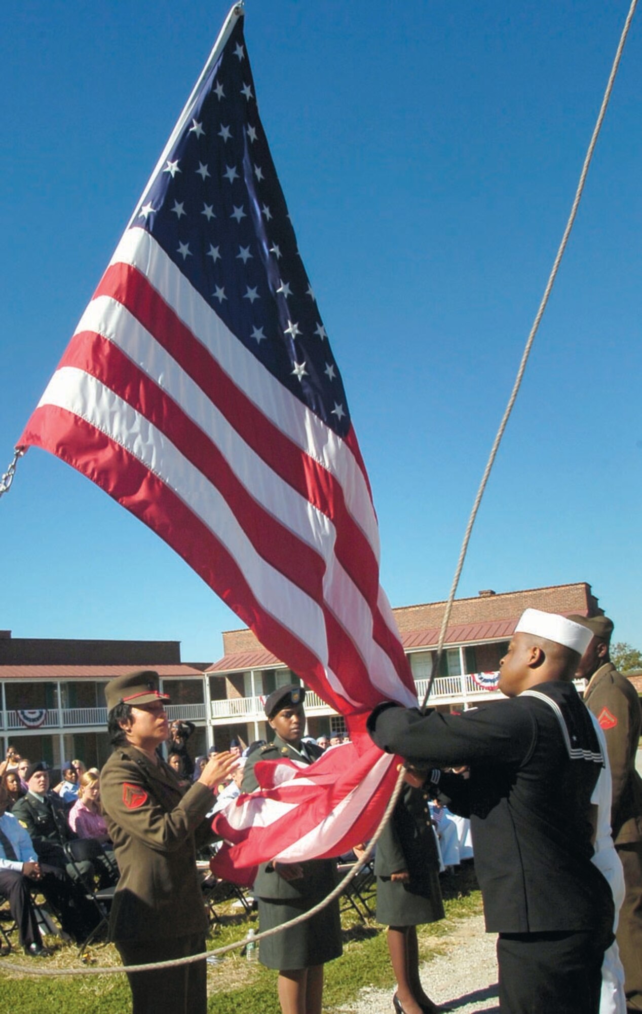 Servicemembers from the Army, Navy, Marines and Air Force participated in the flag ceremony prior to the naturalization ceremony. (US Air Force/Bobby Jones)