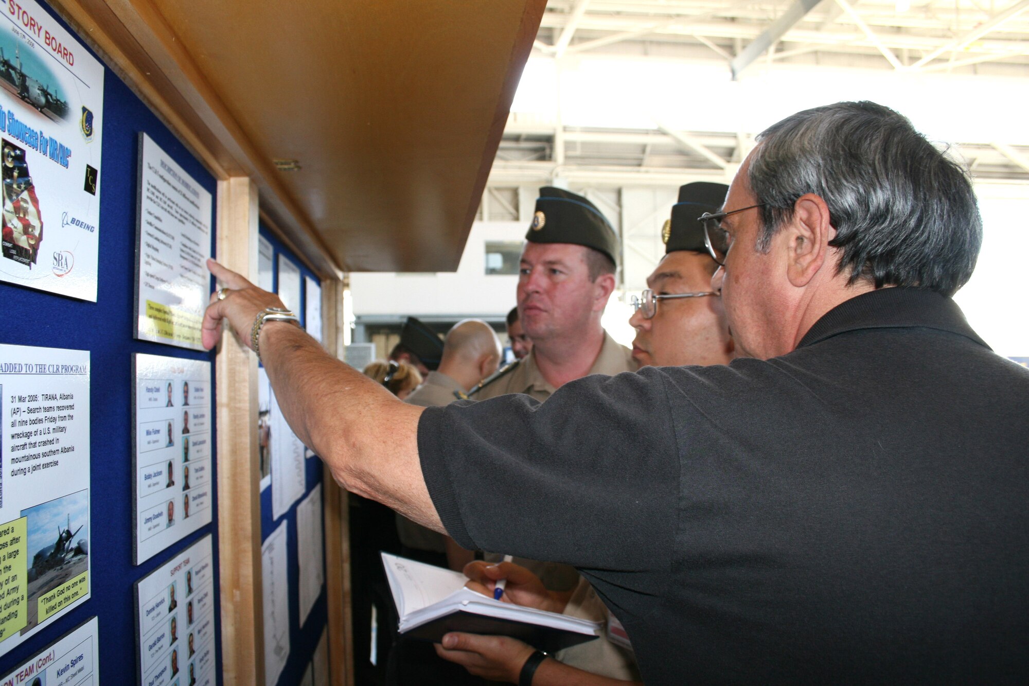 Kazakhstan Igor Bekman explains information about the combat loss replacement C-130 Hercules modification program to Republic of Kazakhstan air force Lt. Col. Valeriy Zhllenko and Maj. Yerzhan Bisembayev Sept. 11 at Robins Air Force Base, Ga. Mr. Bekman is a a contract interpreter for the U.S. Department of the State. Colonel Zhllenko is a deputy chief of military unit 53975, and Major Bisembayev is a senior engineer for military unit 53975.  (U.S. Air Force photo/Amanda Creel)
