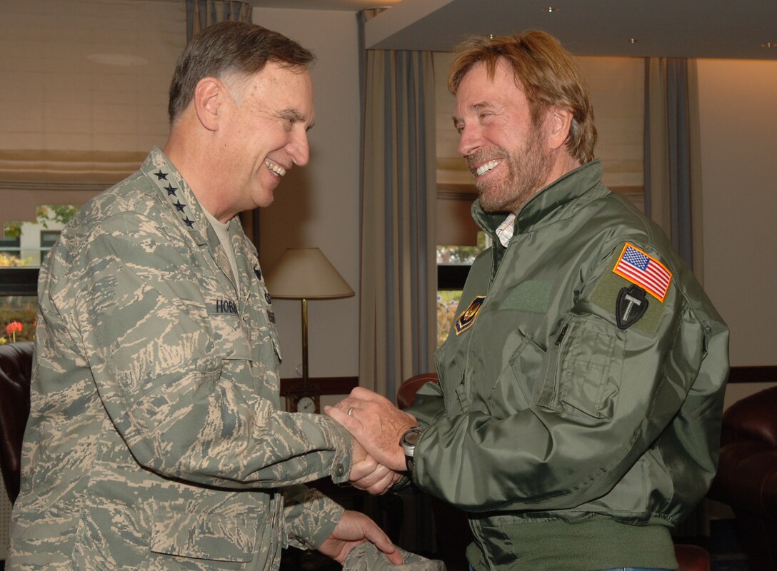 Gen. Tom Hobbins, U.S. Air Forces in Europe commander, thanks actor Chuck Norris for his visit to Ramstein Air Base, Germany, 19 September. Chuck Norris visited various bases overseas to thank Airmen, Marines, Soldiers, and Sailors for their service to our nation. (U.S. Air Force Photo by Airman 1st Class Kelly LeGuillon) 