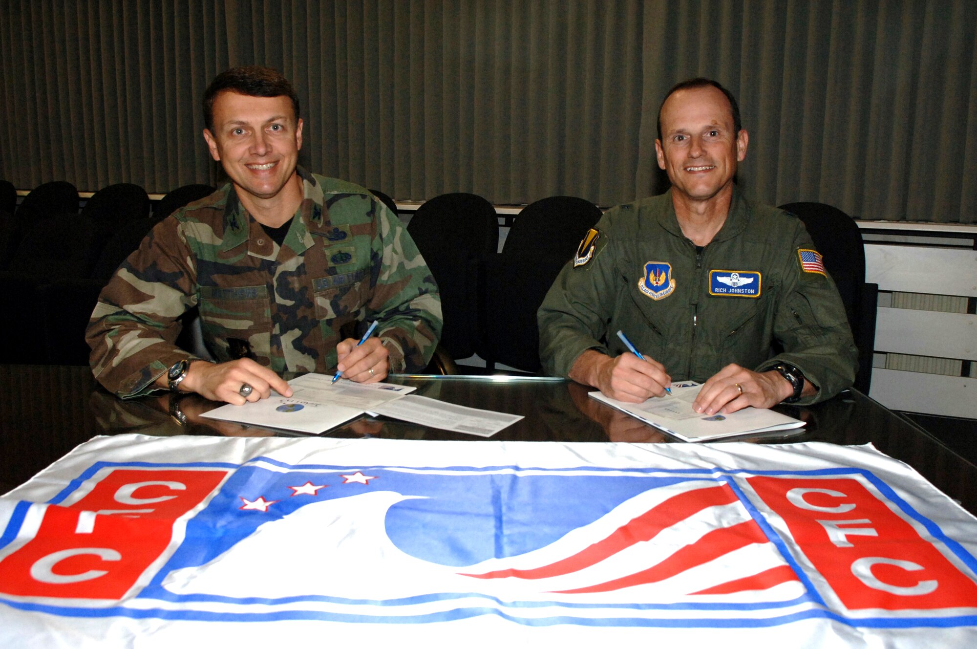 Col. Earl Matthews, 435th Air Base Wing commander, and Brig. Gen. Rich Johnston, KMC and 86th Airlift Wing commander, complete their Combined Federal Campaign forms, which allows servicemembers to support numerous charities and non-profit organizations. CFC officially kicks off Monday. (U.S. Air Force Photo by Airman 1st Class Kelly LeGuillon) 