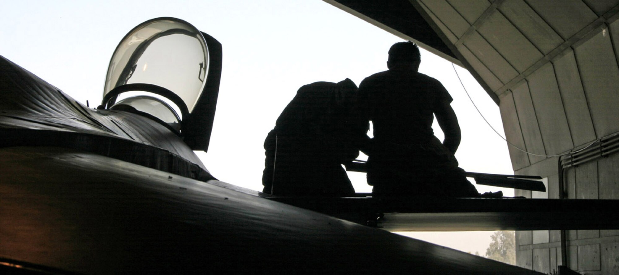 Maintainers at Balad Air Base, Iraq, work on an Air Force aircraft to keep it ready to support the coalition mission. Coalition aircraft fly hundreds of missions in support of Operation Enduring Freedom and Operation Iraqi Freedom. (U.S. Air Force photo/Staff Sgt. Adam Bradford) 