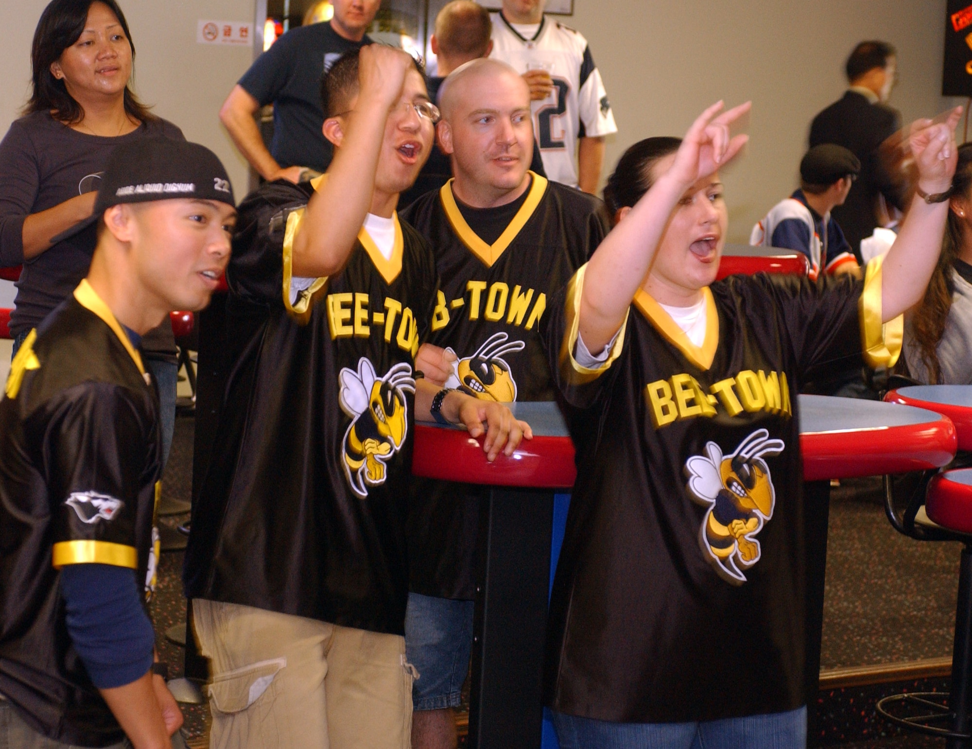 KUNSAN AIR BASE, South Korea -- Airmen from the 8th Medical Group, cheer for a fellow teammate during their bowling game Sept. 28 here. The MDG, along with others, participated in a number of events during the 8th Fighter Wing Sports Day. The sports day allows Airmen a way to compete in friendly and fun competitions, helping to build esprit de corps. The day kicked off with a wing run and events, ranging from a Texas Hold 'Em tournament to unit paintball challenges. (U.S. Air Force photo/Senior Airman Steven R. Doty)                               