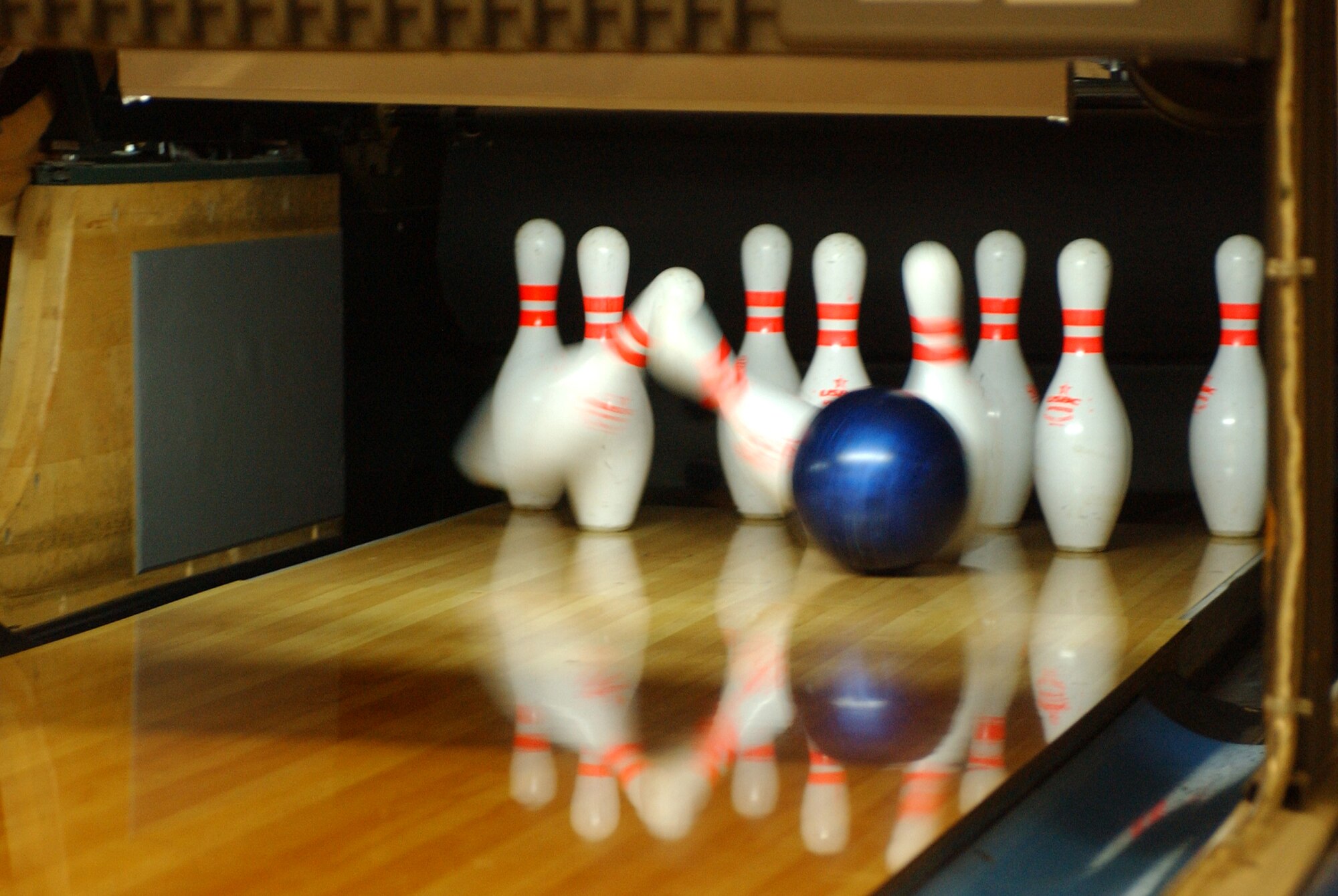 KUNSAN AIR BASE, South Korea - A ball connects with pins during the Wing Sports Day bowling competition Sept. 28 here. Airmen from across from the 8th Fighter Wing participated in a number of events during the Wing Sports Day. The sports day allows Airmen a way to compete in friendly and fun competitions, helping to build esprit de corps. The day kicked off with a wing run and events, ranging from a Texas Hold 'Em tournament to unit paintball challenges. (U.S. Air Force photo/Senior Airman Steven R. Doty)                               