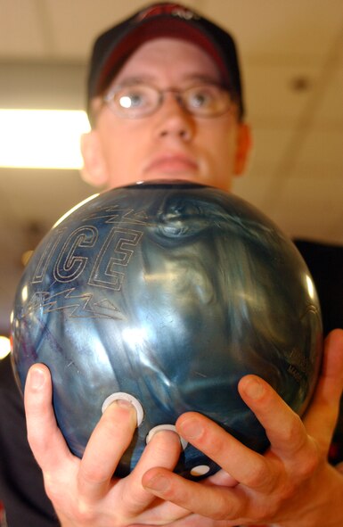 KUNSAN AIR BASE, South Korea - Senior Airman Shannon Witt, 8th Communications Squadron, prepares to bowl Sept. 28 here. Airmen Witt, along with others, participated in a number of events during the 8th Fighter Wing Sports Day. The sports day allows Airmen a way to compete in friendly and fun competitions, helping to build esprit de corps. The day kicked off with a wing run and events, ranging from a Texas Hold 'Em tournament to unit paintball challenges. (U.S. Air Force photo/Senior Airman Steven R. Doty)                               
