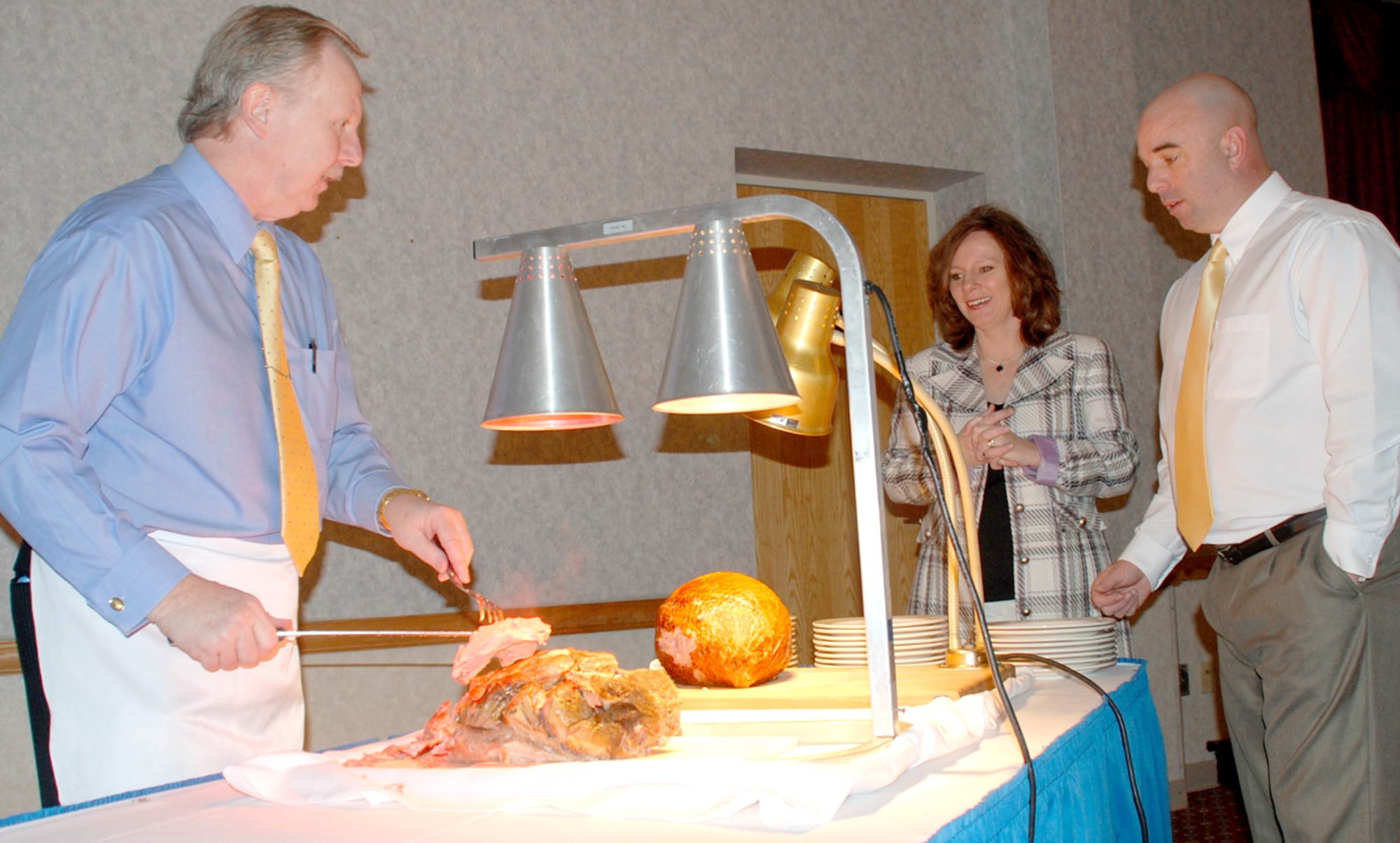 Dennis Essleman serves meat to patrons of the Easter brunch Sunday in the Trail's End Club. More than 50 Warren members and their families attended the event (U.S. Air Force photo/Airman 1st Class Daryl Knee).
