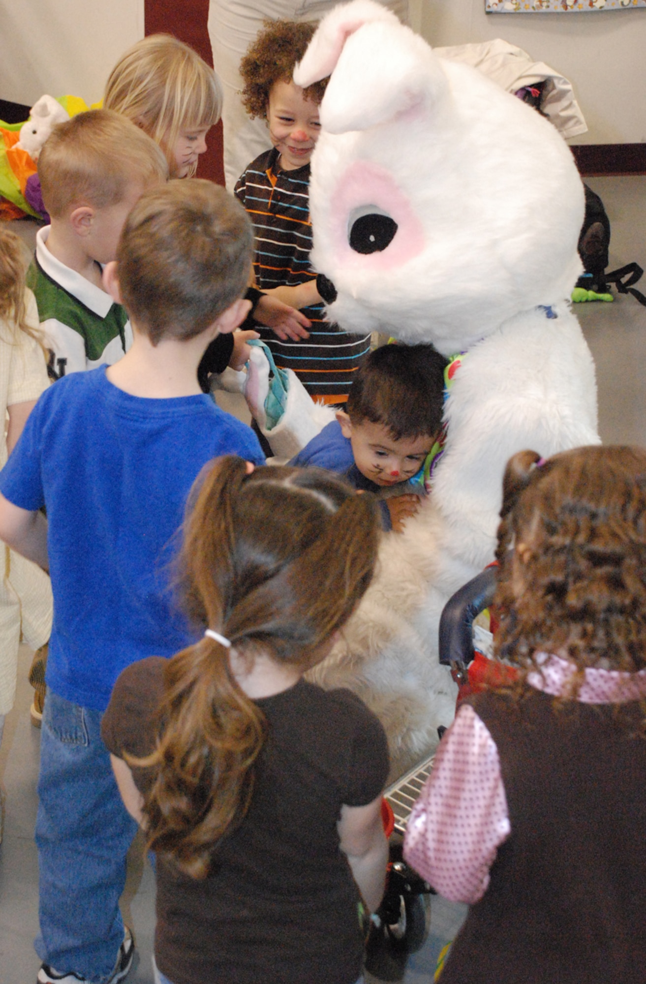 The Easter bunny greets 52 children March 19 in Warren’s Youth Center. The event was sponsored by family child care office. All the children took pictures with the Easter bunny and went outside to gather about 1,000 eggs that were donated by the family child care office (U.S. Air Force photo/Staff Sgt. Chad Thompson).