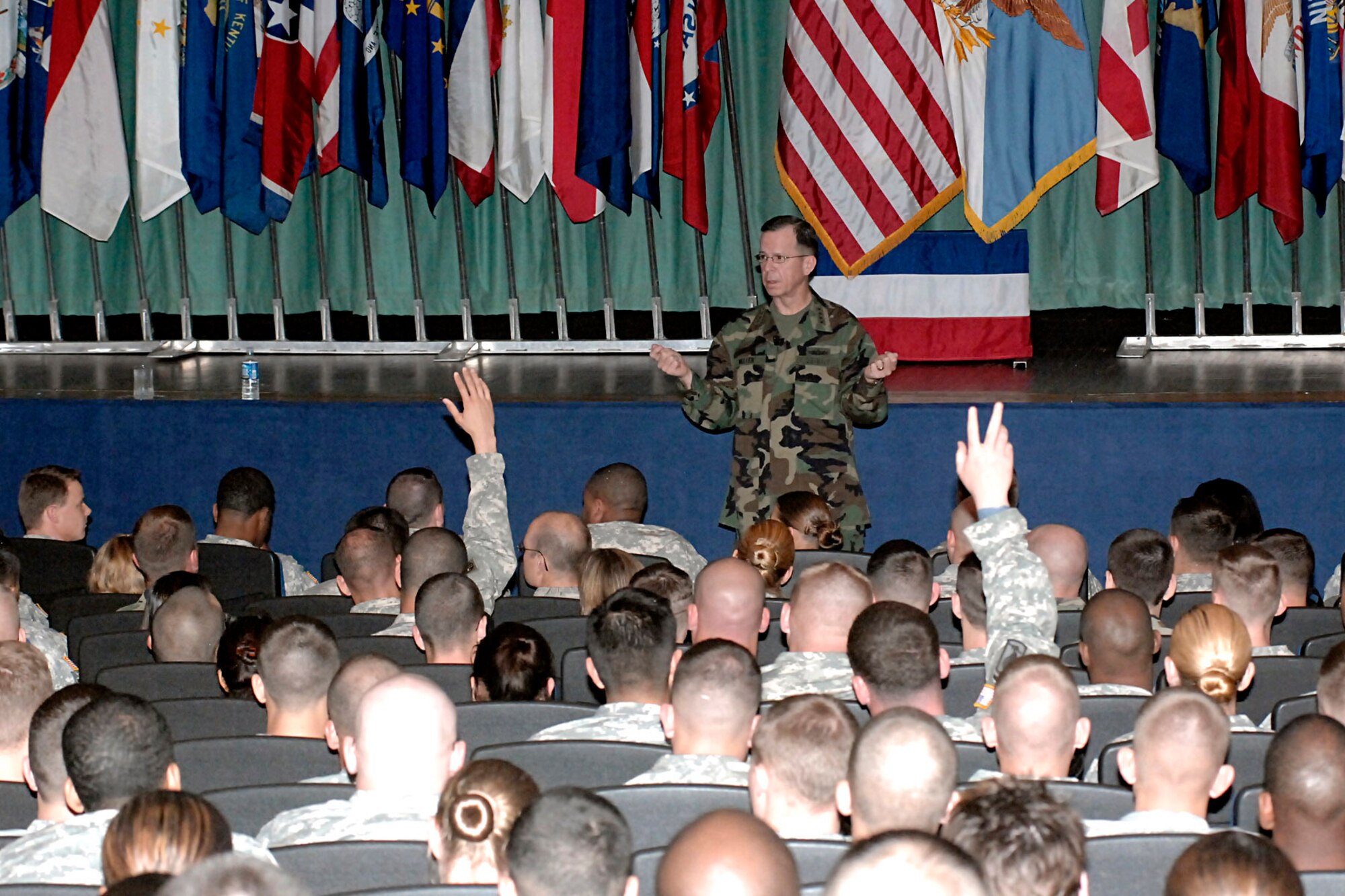 Adm. Mike Mullen, chairman of the Joint Chiefs of Staff, speaks to Pope Air Force Base Airmen and Fort Bragg Soldiers March 31 at the Pope theatre.  Admiral Mullen was there to tour the two installations and visit with servicemembers.  (U.S. Air Force photo /Mike Murchison)