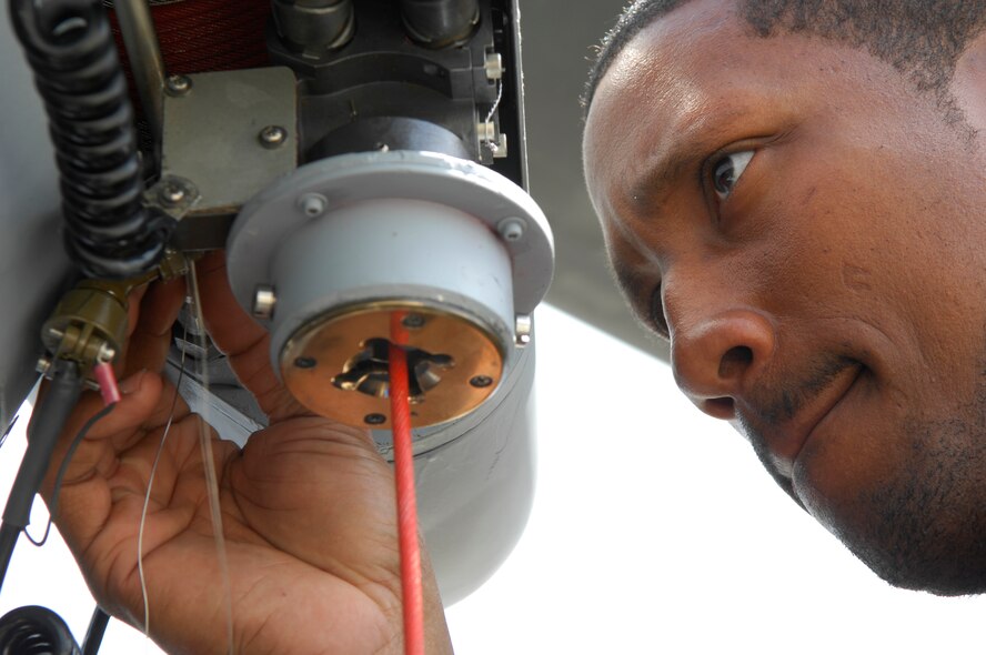 MOODY AIR FORCE BASE, Ga. -- Staff Sgt. Ray Campbell, 723rd Aircraft Maintenance Squadron HH-60G Pave Hawk electrical and environmental craftsman, safety-wires the electrical connector on a rescue hoist here April 1. All critical connectors and bolts on the Pave Hawk are secured with steel safety wire to keep them from falling off. (U.S. Air Force photo by Tech. Sgt. Parker Gyokeres)
