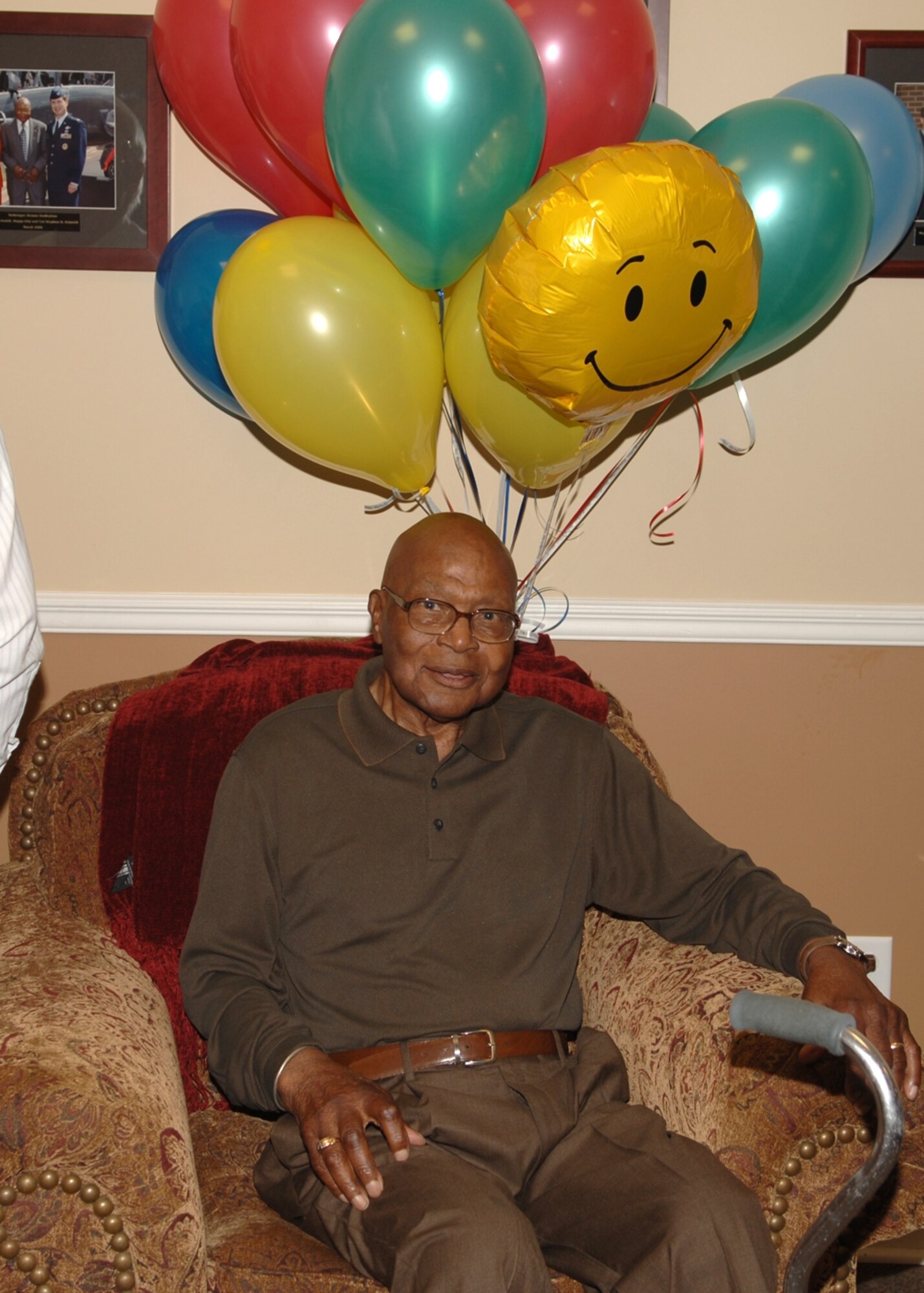 George "Happy" Irby celebrated his 93rd birthday with a group of Columbus AFB personnel Friday morning. Irby, a former bartender at what was known as the Officer's Mess Hall, shares his stories and experiences Wednesdays and Fridays at the Columbus Club. The Happy Lounge located inside the Club was named in his honor. (U.S. Air Force photo by Elizabeth Owens)