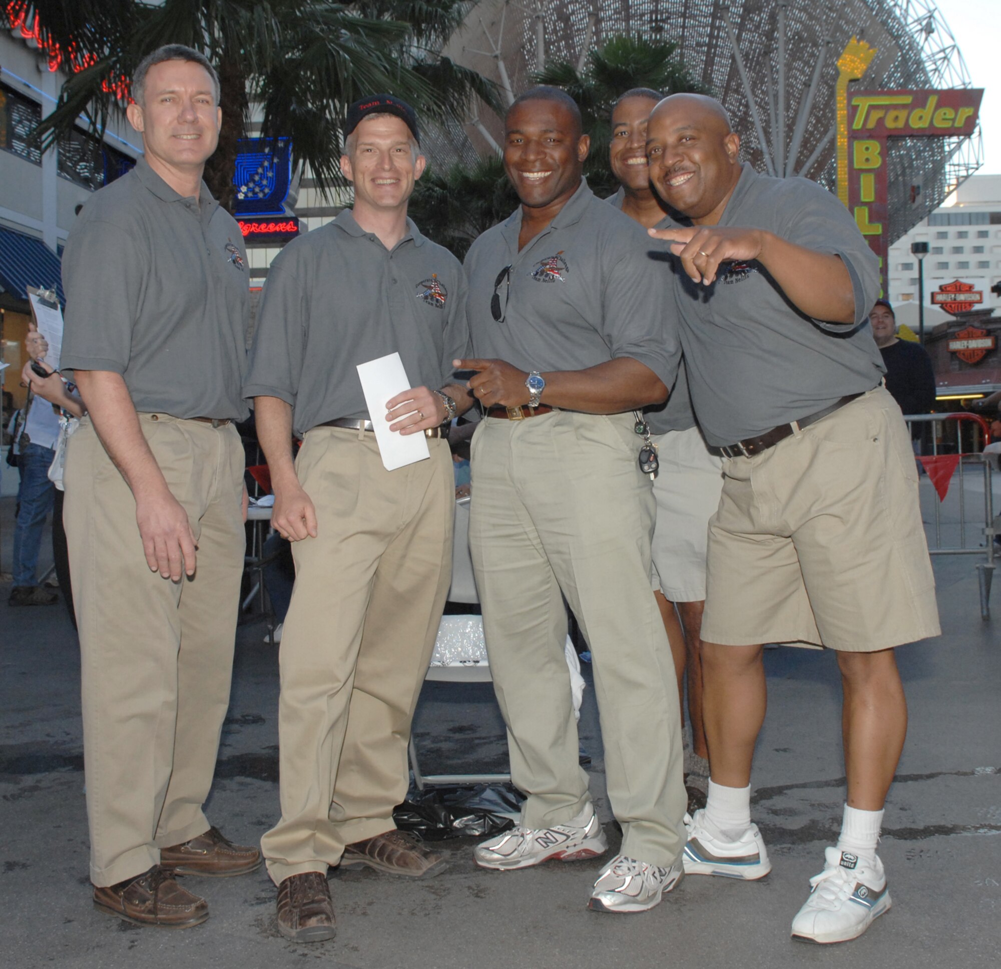LAS VEGAS -- (From left to right) Col. Kenneth Keskel, 99th Air Base Wing vice commander, Chief Master Sgt. Robert Brooks, 99th Air Base Wing command chief, Col. Gerald Curry, 99th Security Forces Group commander, Lt. Col. Ronald Coleman, 99th Mission Support Group duputy commander and Chief Master Sgt. Vernon Boardley, 99th Mission Support Group chief enlisted manager, stop for a photo during the conculsion of the Las Vegas Corporate Challenge executive relay March 26. Team Nellis placed sixth in the executive relay event with a time of three minutes and 40 seconds. (U.S. Air Force Photo/Senior Airman Larry E. Reid Jr.)