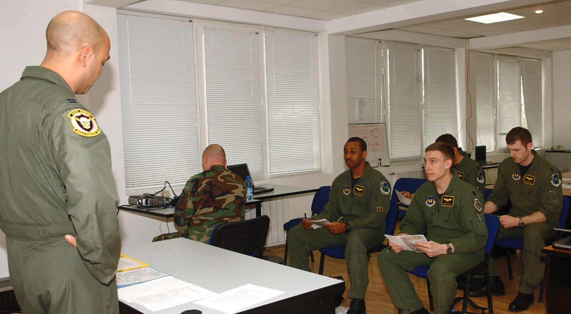 Capt. Danny Cannon briefs aircrews prior to a mission supporting the NATO summit in Romania April 1 at Graf Ignatievo Air Base, Bulgaria. F-15 Eagles deployed from Royal Air Force Lakenheath, England, are projecting airpower in support of the NATO summit in Bucharest, Romania. Captain Cannon is the 493rd Expeditionary Fighter Squadron chief of scheduling. (U.S. Air Force photo/Tech. Sgt. J. LaVoie)