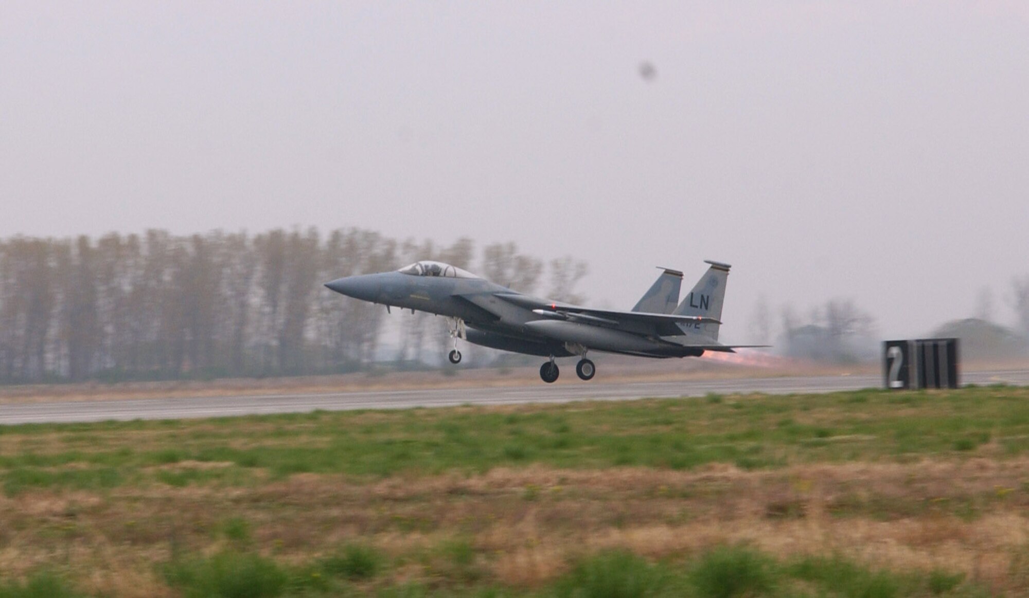 An F-15 Eagle takes off on an air policing mission in support of Operation Noble Endeavor April 1 at Graf Ignatievo Air Base, Bulgaria. F-15s deployed from Royal Air Force Lakenheath, England, are projecting airpower in support of the NATO summit in Bucharest, Romania. (U.S. Air Force photo/Tech. Sgt. J. LaVoie) 
