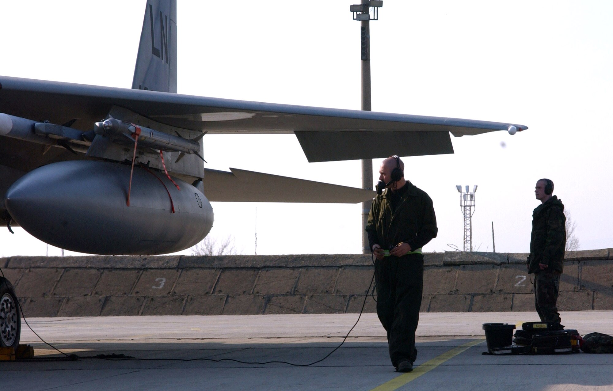 Senior Airman John Ott performs preflight checks prior to an F-15 Eagle air policing mission in support of Operation Noble Endeavor March 31 at Graf Ignatievo Air Base, Bulgaria. F-15s deployed from Royal Air Force Lakenheath, England, are projecting airpower in support of the NATO summit in Bucharest, Romania. Airman Ott is a 493rd Expeditionary Fighter Squadron assistant crew chief. (U.S. Air Force photo/Tech. Sgt. J. LaVoie) 
