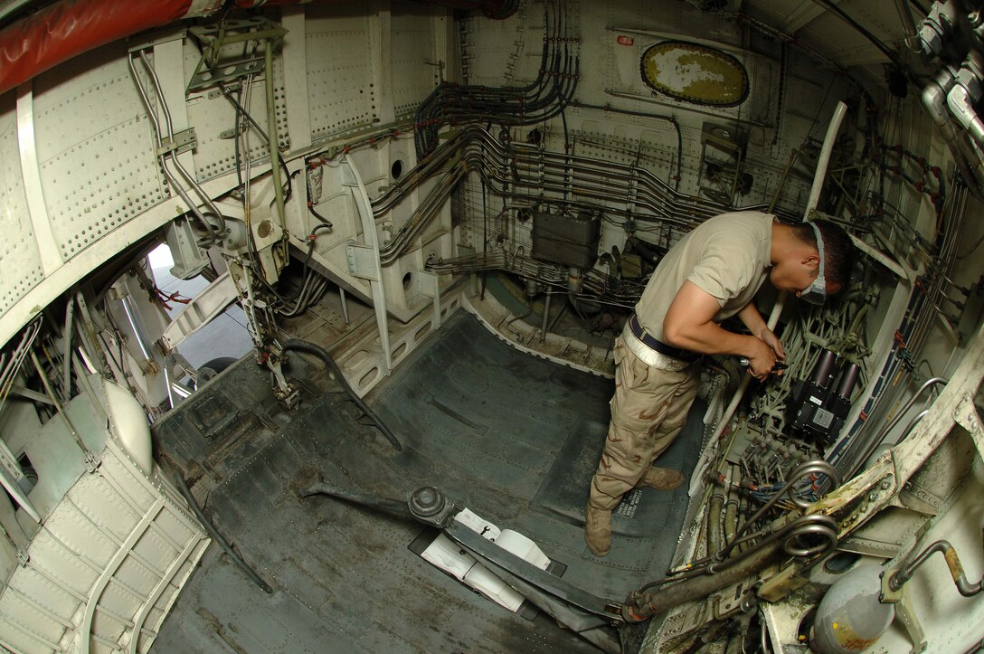 Senior Airman Jay Barros removes a flap limit actuator from a KC-10 Extender March 27 at a base in Southwest Asia. Providing 6.5 million pounds of jet fuel weekly, the KC-10 and the Airmen of the 380th Air Expeditionary Wing who support it give global reach to U.S. and coalition aircraft supporting operations Enduring Freedom and Iraqi Freedom. Airman Barros is a 380th Expeditionary Aircraft Maintenance Squadron hydraulics specialist. (U.S. Air Force photo/Senior Airman Levi Riendeau)