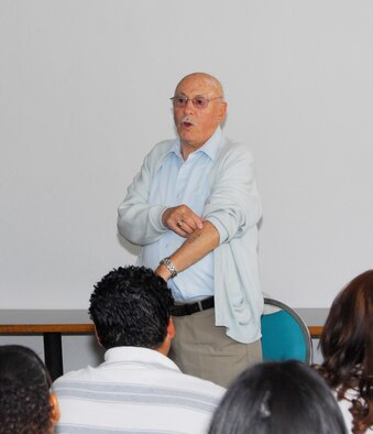 Holocaust survivor Irving Senor shows Tucson-area high school students the concentration camp number etched into his arm 64 years ago at Auschwitz during World War II. Senor, along with six other survivors, spoke to more than 300 students at the 162nd Fighter Wing for a Holocaust remembrance program, March 27. (Photo by Master Sgt. Dave Neve, 162nd Fighter Wing)