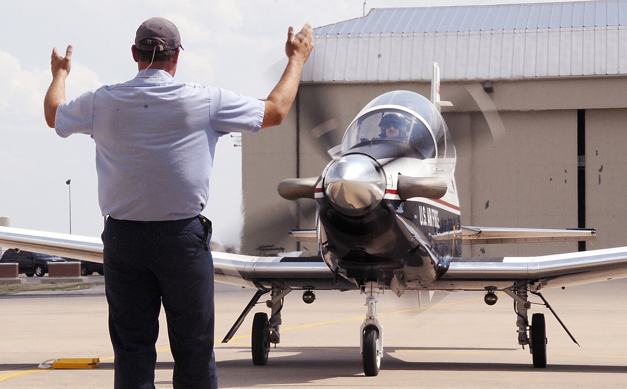 89th Flying Training Squadron instructor pilot Capt. Brian Wood taxis up to the chocks March 31, marking the official arrival of the T-6A Texan II, the replacement for the antiquated T-37 Tweet. Also in the aircraft was Italian Brig. Gen. Franco Marsiglia, the incoming Euro-NATO Joint Jet Pilot Training Program Steering Committee chairman. A total of 69 Texan IIs will replace 74 T-37 Tweets. (U.S. Air Force photo/Harry Tonemah) 