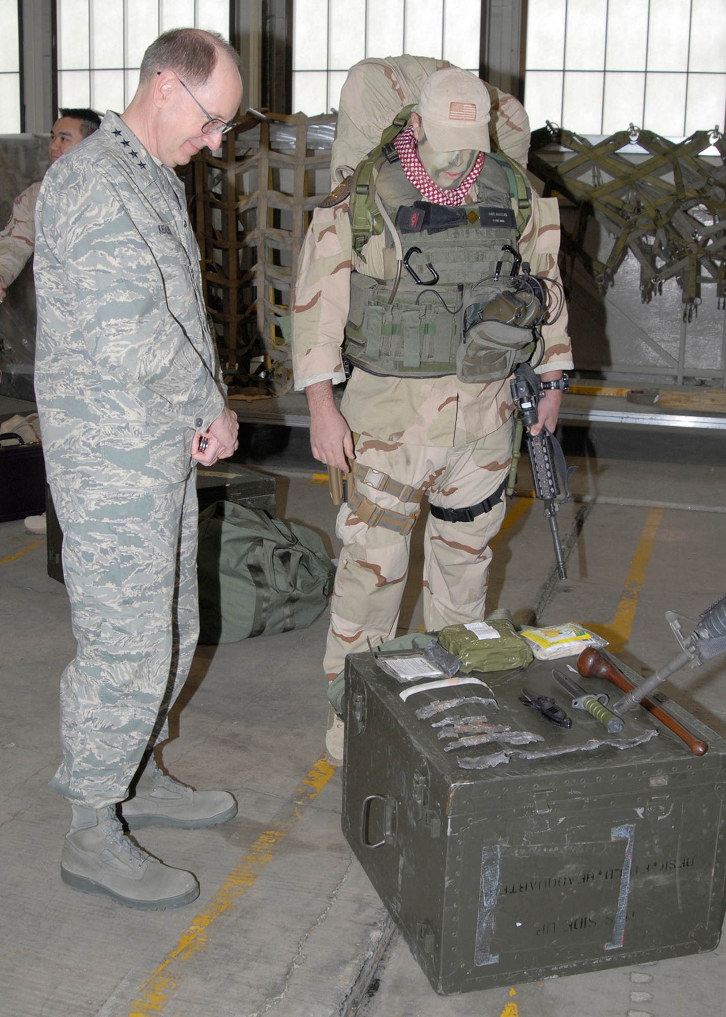 Capt. David Andrews, 21st Medical Support Squadron Logistics Flight commander, talks with Gen. C. Robert Kehler, Air Force Space Command commander, about his deployment to Afghanistan during the general’s visit March 28. (U.S. Air Force photo/Roberta McDonald)