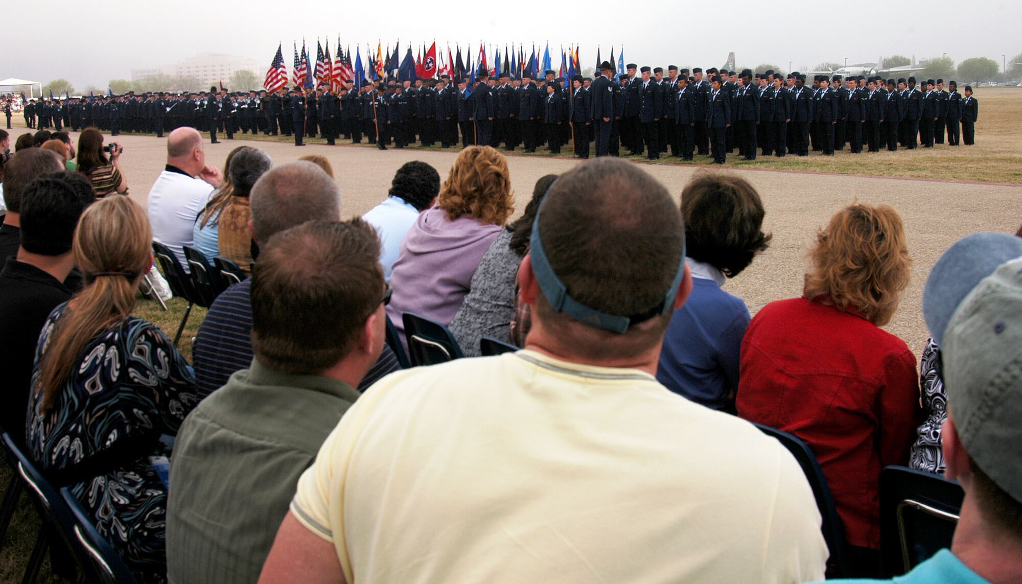 Air Force Recruiting Service Distinguished Educator Tour guests witness an Air Force Basic Military Training graduation ceremony at Lackland Air Force Base, Texas, March 14. Following the ceremony, tour guests have the opportunity to congratulate the graduates and speak to them about their choice to enlist. Air Force Recruiting Service conducts two tours annually to show high school and community college counselors, teachers and principals that, for their best students, the Air Force may be an ideal choice. (U.S. Air Force photo/Staff Sgt. Jennifer Lindsey)
