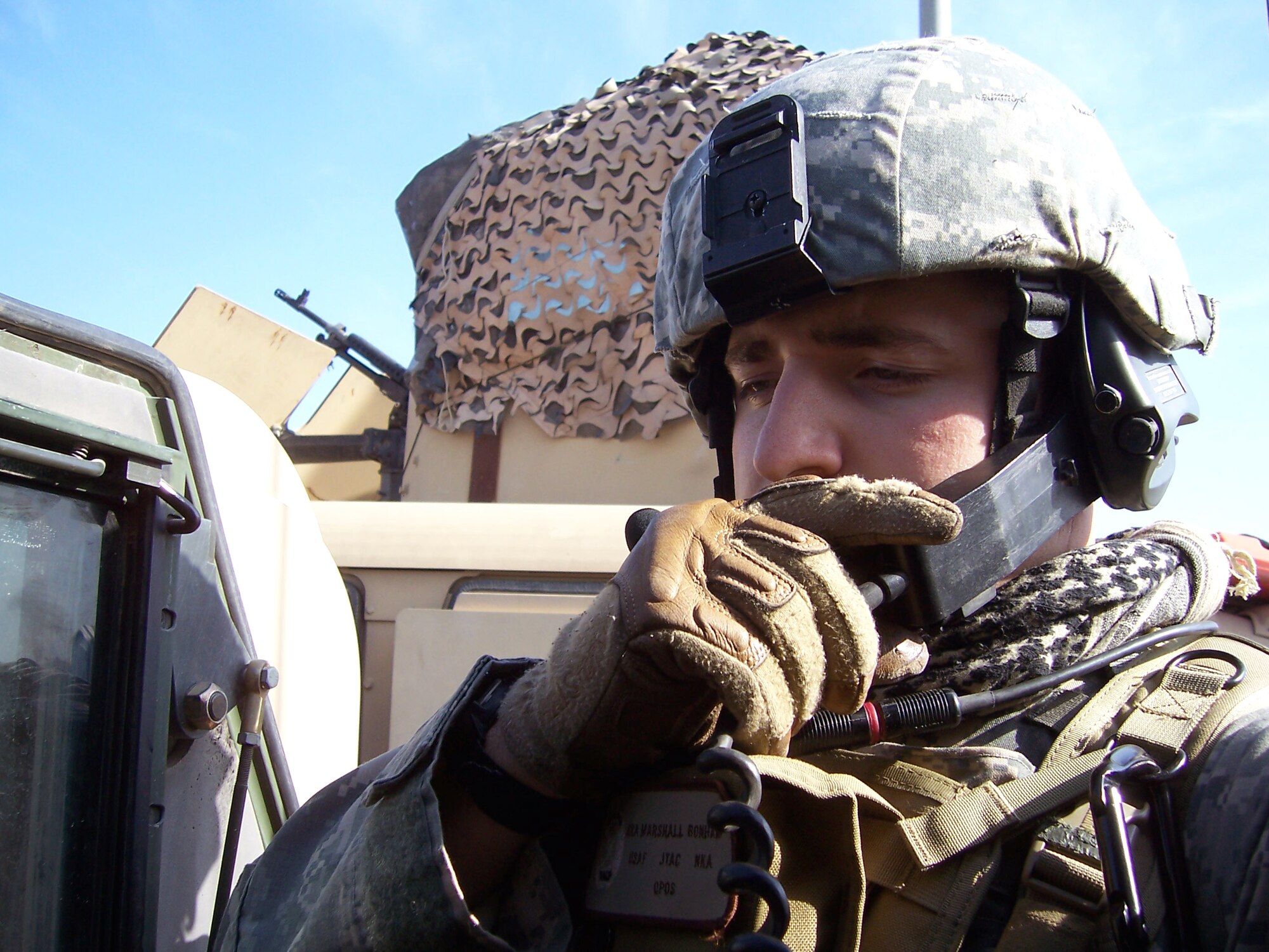 Staff Sgt. Marshall Bonham, a 1st Expeditionary Air Support Operations Squadron
joint terminal attack controller, talks to aircraft pilots via radio transmission. The JTAC is the communications link between Air Force pilots and Army units on the ground. Sergeant Bonham is deployed from Dyess Air Force Base, Texas. (courtesy photo)
