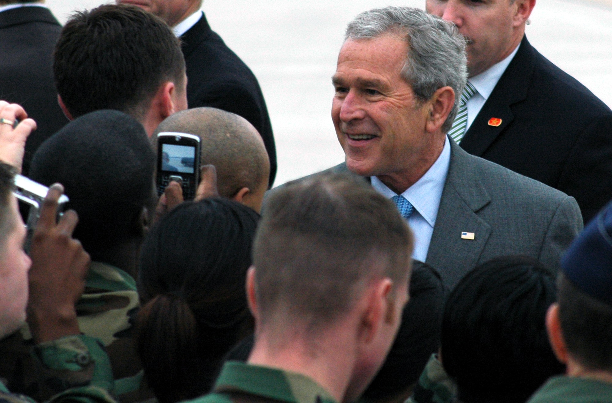 President of the United States George W. Bush shakes hands and greets Airmen at McGuire Air Force Base, N.J., March 28, 2008.  The President came through McGuire en route to a pre-scheduled visit to Freehold, N.J.  (U.S. Air Force Photo/Tech. Sgt. Scott T. Sturkol)
