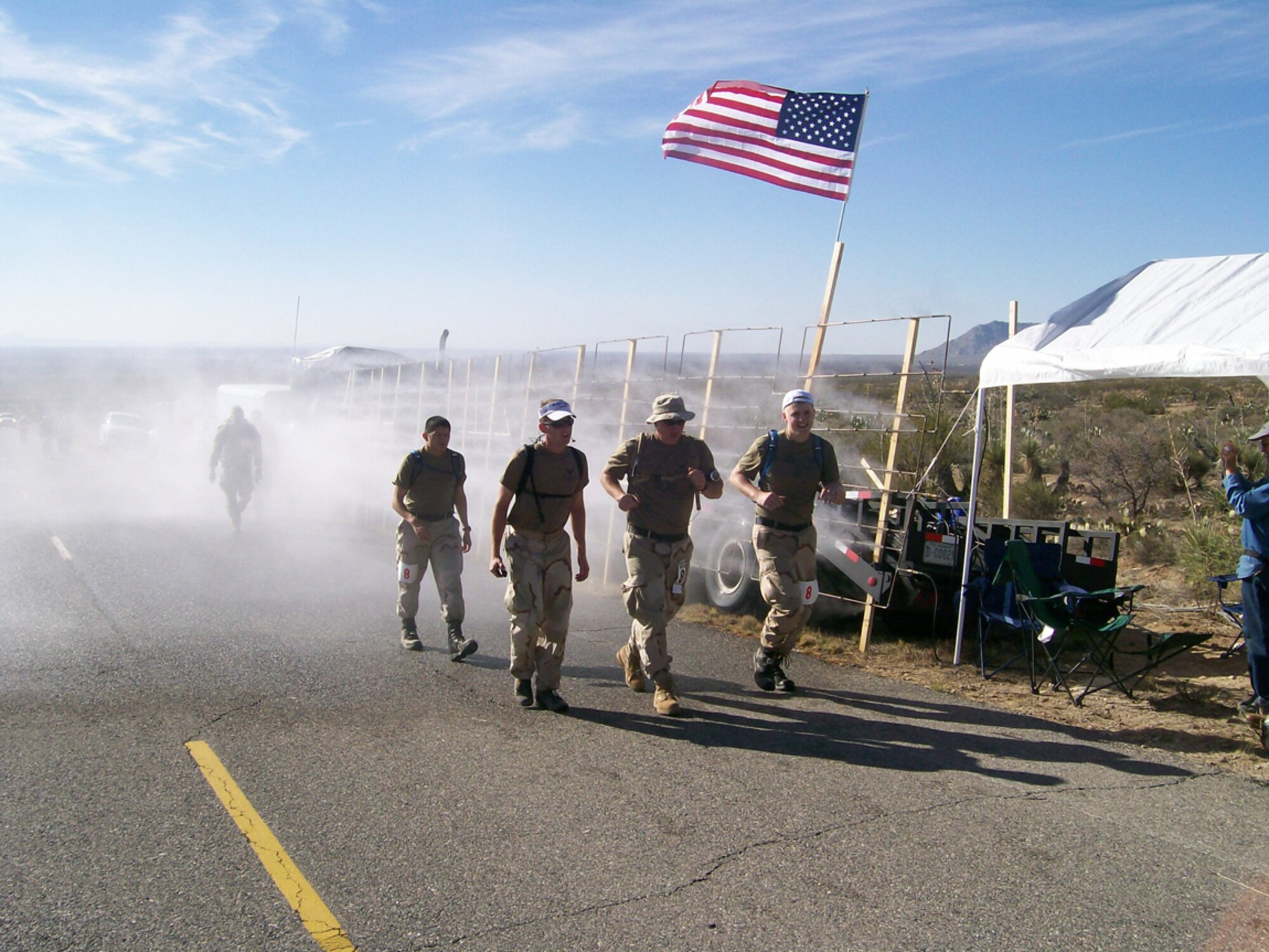 Capt. Colin Lennon, 2nd Lt. Tyler Steffenson, Tech. Sgt. Charles Crockett, and Airman 1st Class Eliott Stokes, all members of the 355th Communications Squadron, compete in the Bataan Memorial Death March in New Mexico March 30. (Courtesy photo)