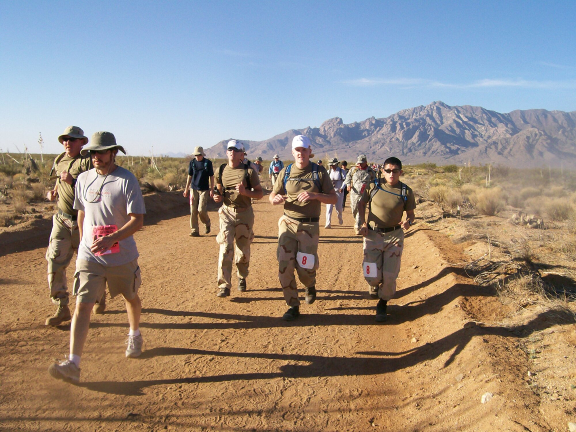 Capt. Colin Lennon, 2nd Lt. Tyler Steffenson, Tech. Sgt. Charles Crockett, and Airman 1st Class Eliott Stokes, all members of the 355th Communications Squadron, compete in the Bataan Memorial Death March in New Mexico March 30. The death march is an annual march conducted in honor of the heroic servicemembers who defended the Philippine Islands during World War II, sacrificing their freedom, health and, in many cases, their very lives.(Courtesy photo)