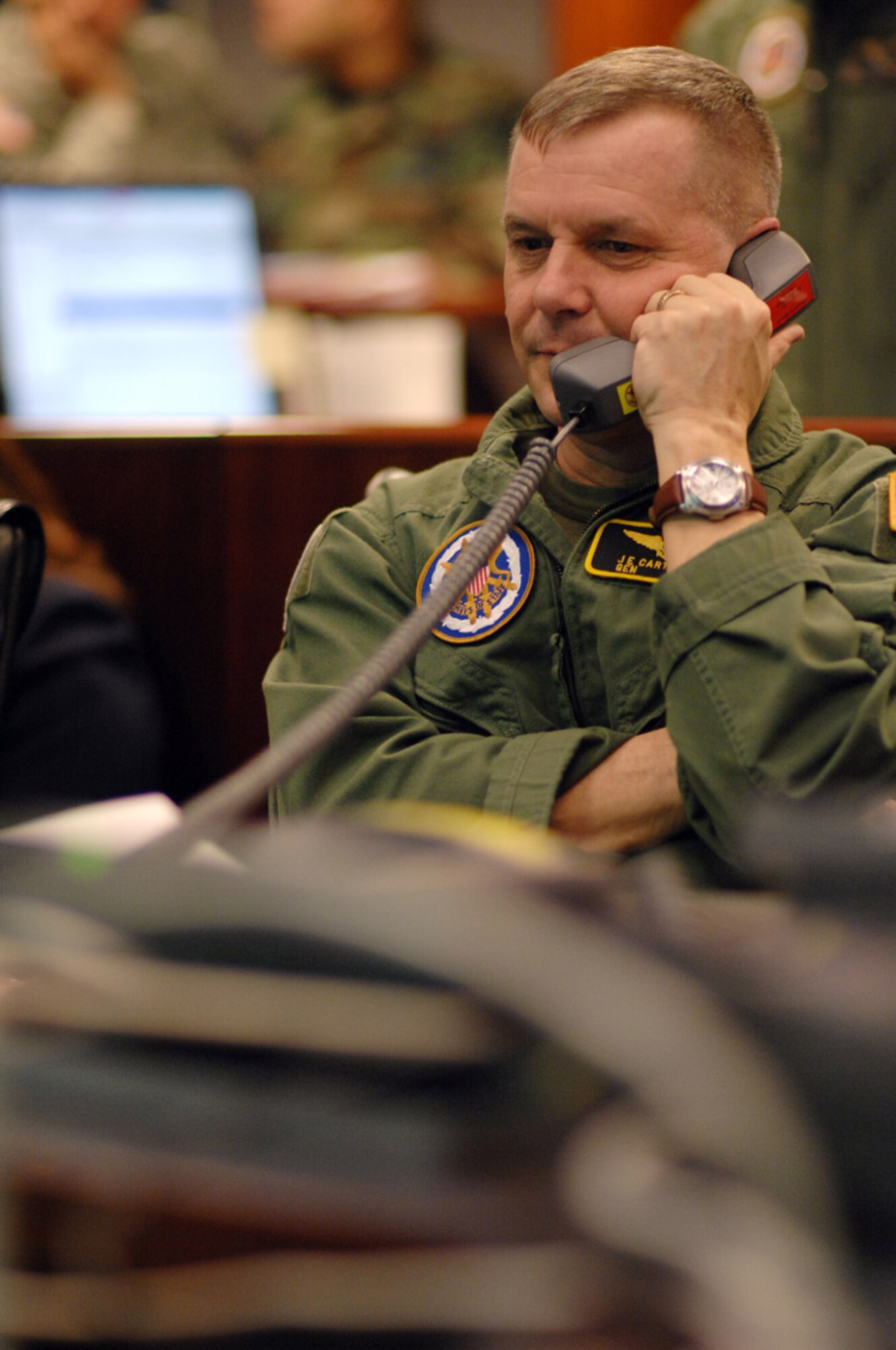 HANSCOM AFB, Mass. - Vice Chairman of the Joint Chiefs of Staff Marine Corps Gen. James E. Cartwright, speaking from the Pentagon’s National Military Command Center Feb. 20, informs Secretary of Defense Robert Gates that a nonfunctioning reconnaissance satellite had been successfully intercepted. (DoD photo by Air Force Tech. Sgt. Adam M. Stump)

