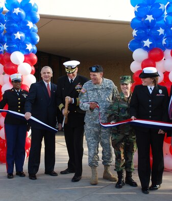 (second from left) Mr. Richard S. Page, acting Director of the Defense Commissary Agency (DECA) assist the installation commander, Navy Capt. Ian McIntyre, and the Army Air Force Exchange Service commander, Brig. Gen. Keith Thurgood, in the ribbon cutting ceremony March 25 as the AAFES BX-Mart converts back to a traditional commissary. Each armed service at the Naval Air Station Joint Reserve Base Carswell Field, Texas, was represented by a female enlisted member such as Airman 1st Class Samantha Payne (second from the right) from the 301st Aircraft Maintenance Squadron. (U.S. Air Force Photo/Tech. Sgt. Julie Briden-Garcia)