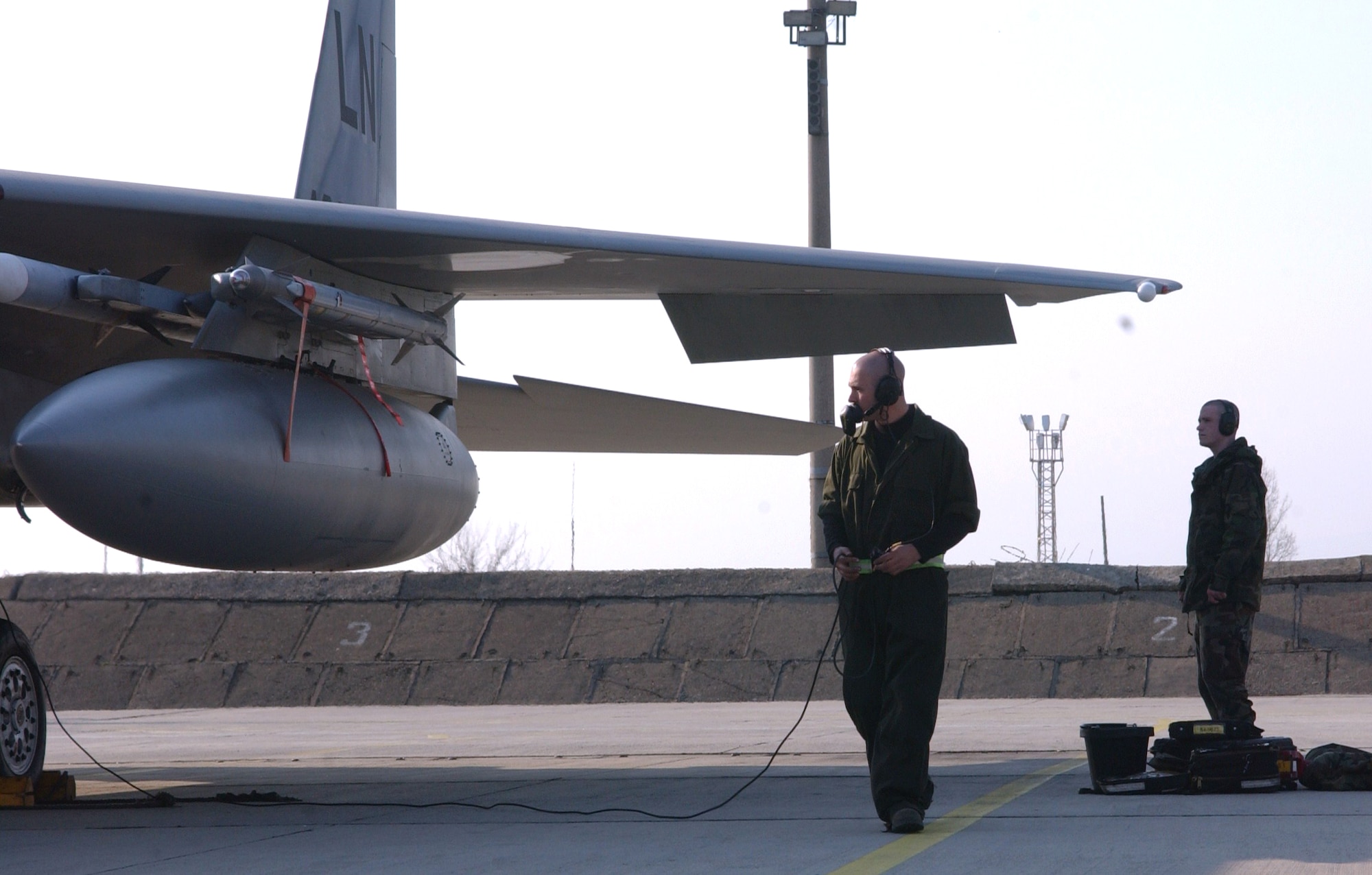 Senior Airman John Ott, 493rd Expeditionary Fighter Squadron assistant dedicated crew chief, performs preflight checks prior to an air policing mission in support of Operation Noble Endeavor. F-15s, deployed from RAF Lakenheath, U.K., are projecting airpower in support of the Romanian NATO summit. (U.S. Air Force photo by Tech. Sgt. J. LaVoie)