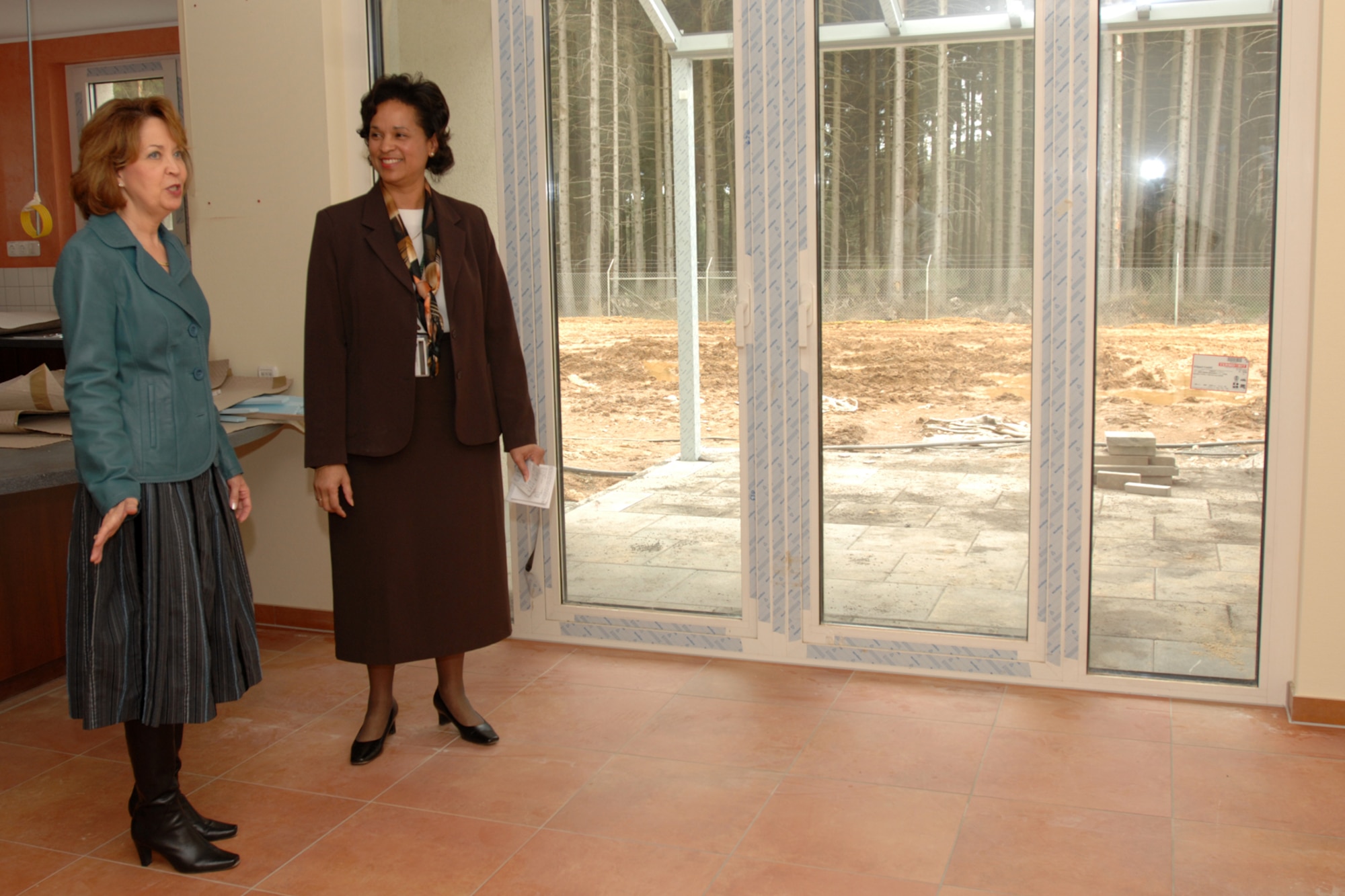 SPANGDAHLEM AIR BASE, Germany -- Litha Brady, wife of U.S. Air Forces in Europe Commander Gen. Roger Brady, and Denise Hastye, 52nd Fighter Wing housing director, take a tour of housing units under construction here March 31, 2008. New housing units are being constructed as part of new family housing construction here. (U.S. Air Force photo/Airman 1st Class Jenifer Calhoun)