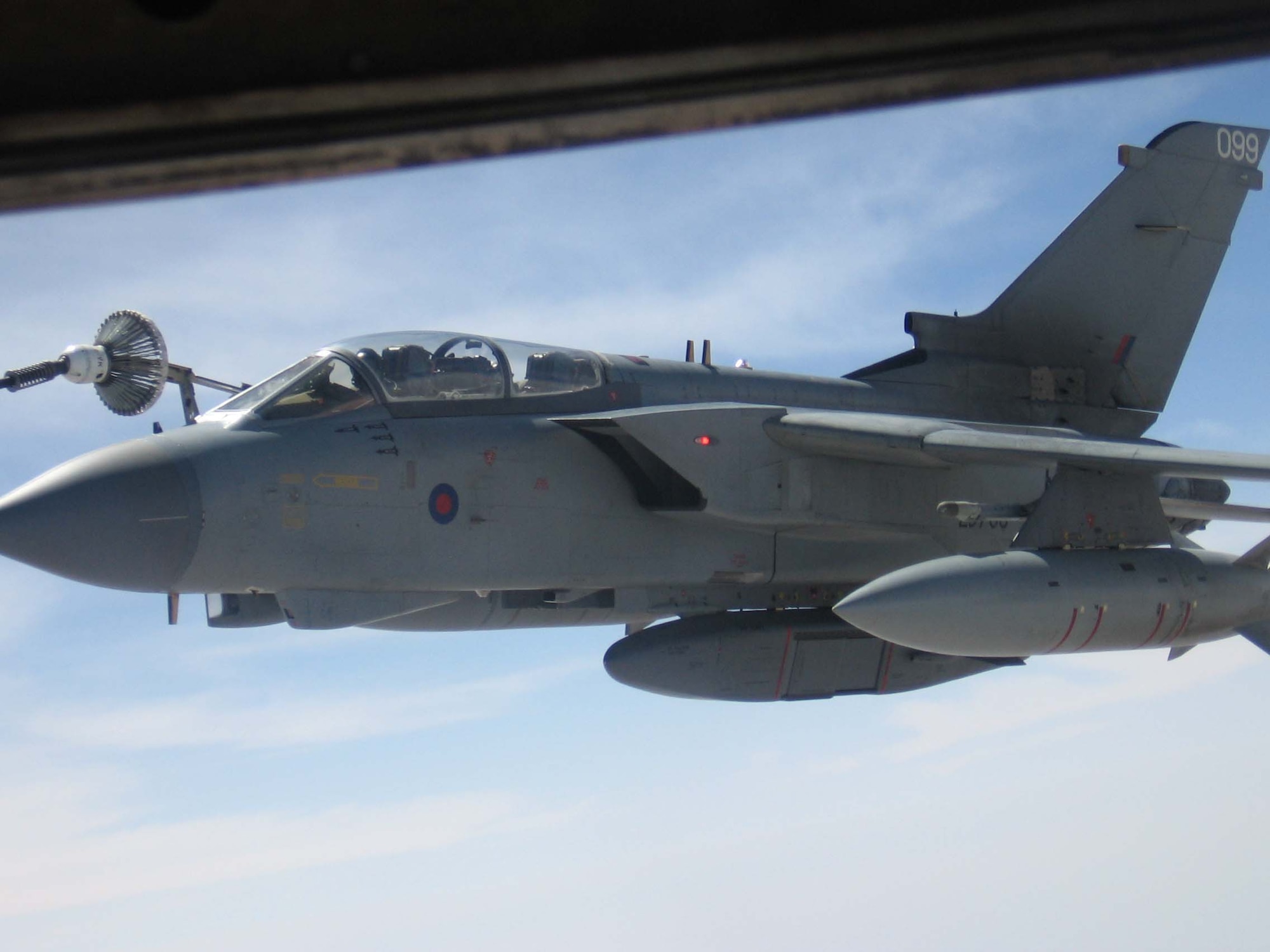SOUTHWEST ASIA -- A Royal Air Force Tornado GR4A pulls up to a U.S. Air Force KC-135 Stratotanker for in-flight refueling this month. The eight Tornados here contribute to the Global War on Terror by providing close air support,  reconnaissance, and a long-range, high-speed precision strike capability. (Photo by Col. Larry Martin)