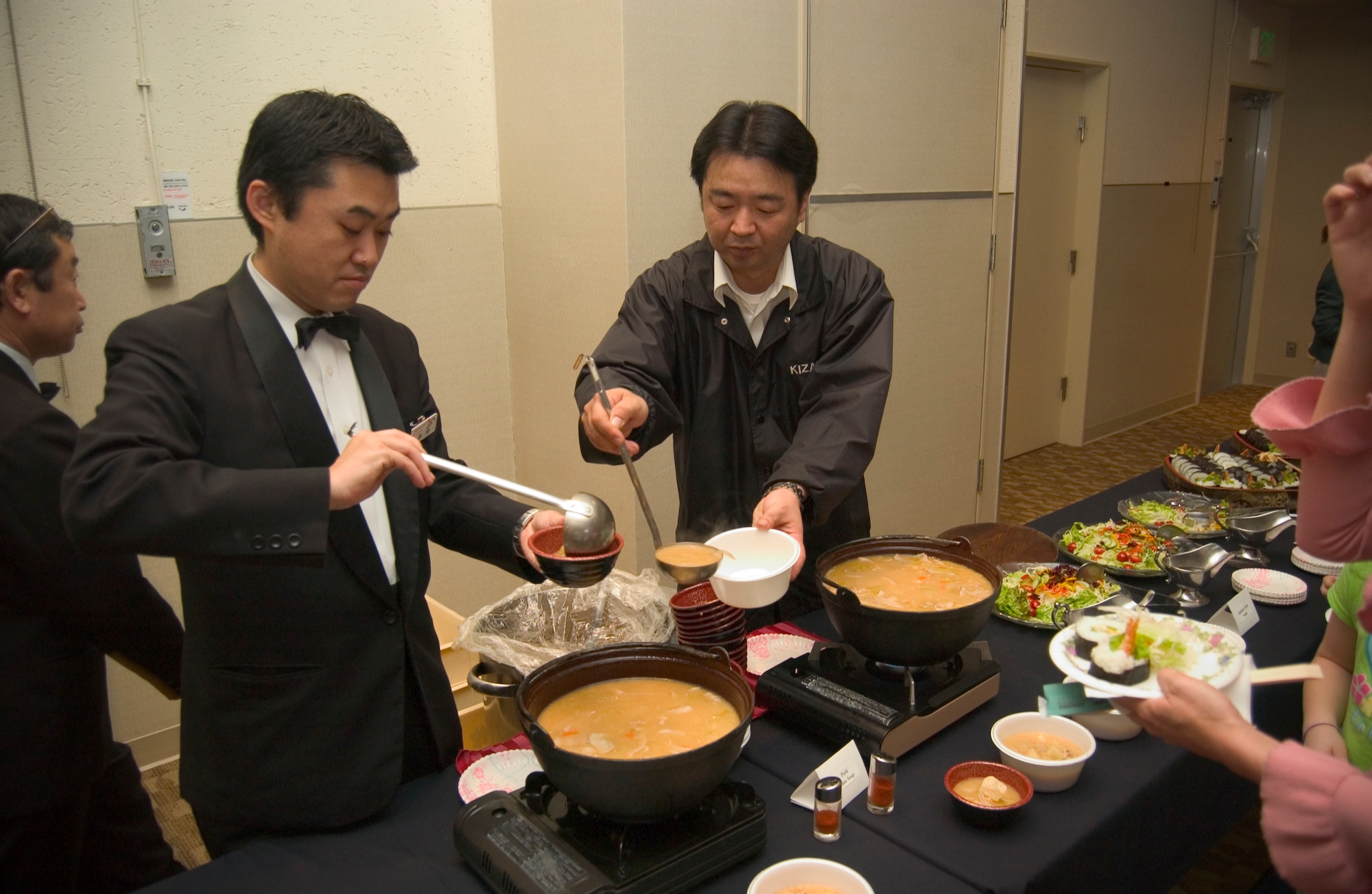 MISAWA AIR BASE, Japan -- Yoshida Masahiro serves soup on March 22, 2008 during the Ocha Kai celebration at the Mokuteki Community Center. The soup was a traditional Japanese dish called "miso soup" consisting largelyy of fermented soybean paste. (U.S. Air Force photo by Senior Airman Samuel Morse)