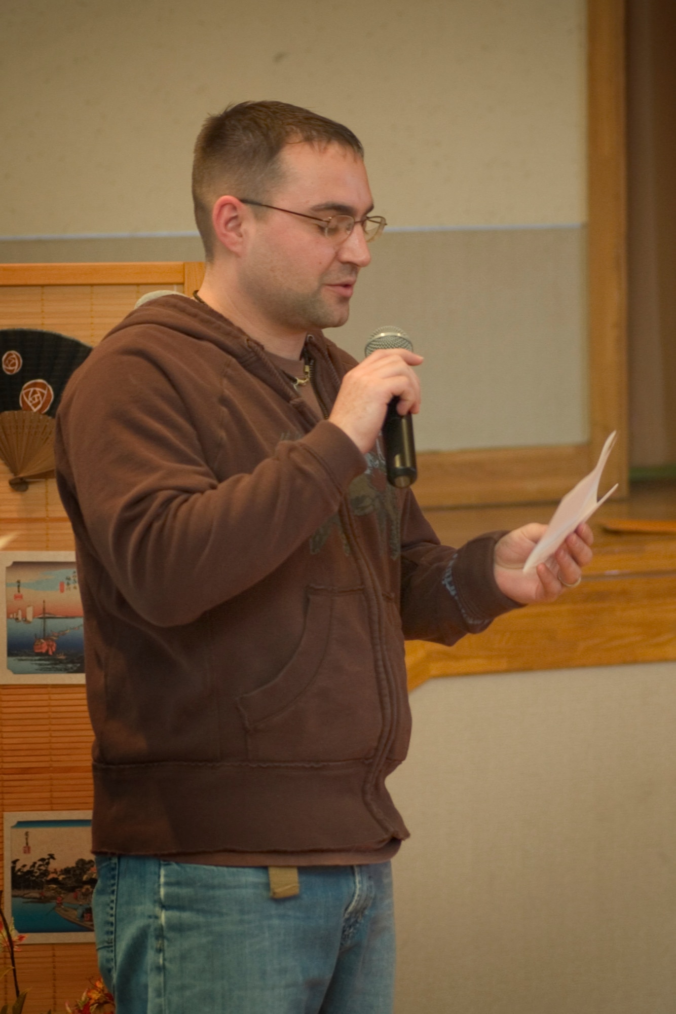 MISAWA AIR BASE, Japan -- Staff Sgt. Michael B. Erb, Misawa Security Operations Center, recites his haiku on March 22, 2008 at the Mokuteki Community Center. Sergeant Erb's poem was the first place winner in the haiku contest during the Ocha Kai celebration. (U.S. Air Force photo by Senior Airman Samuel Morse)