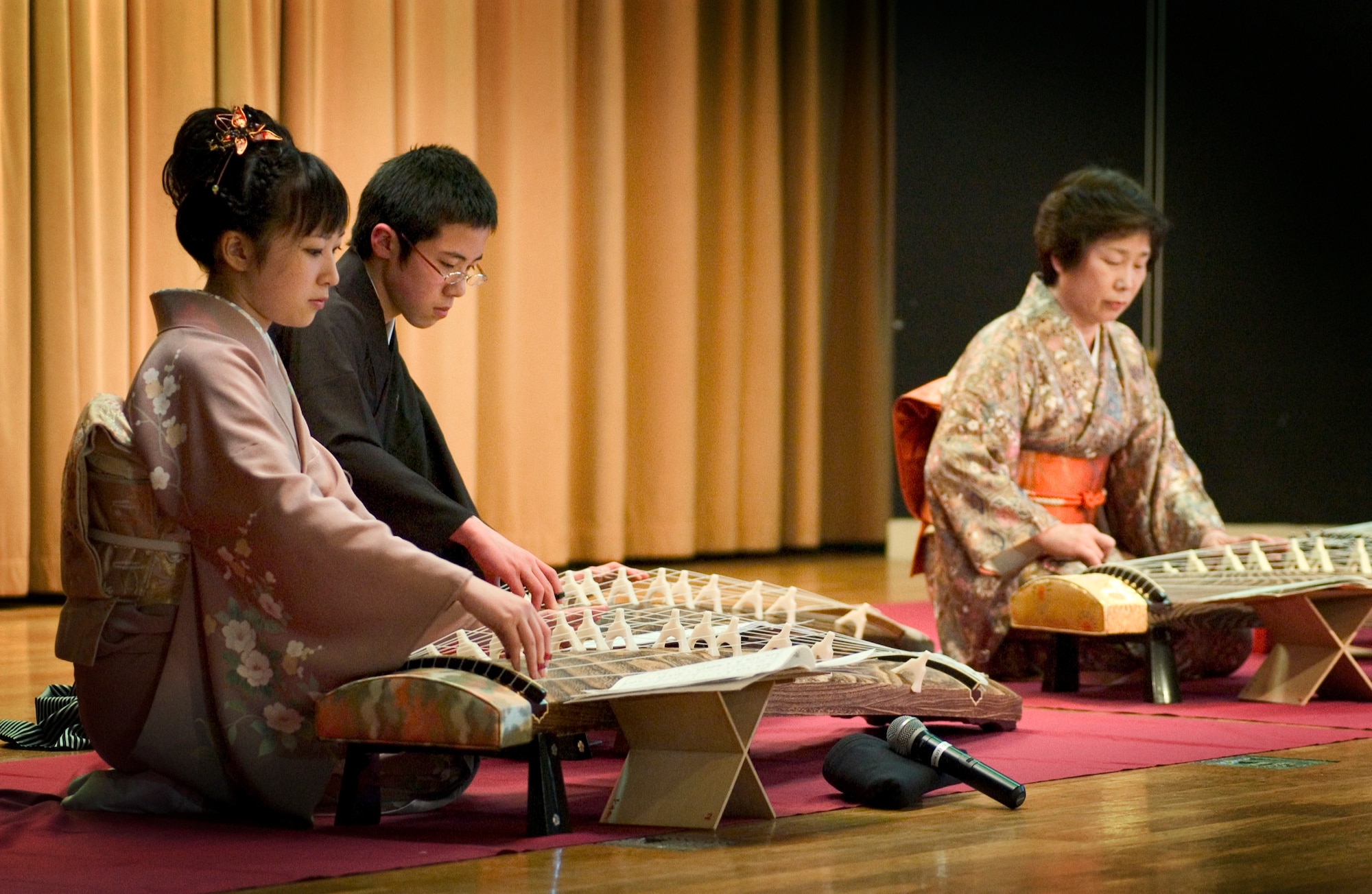 MISAWA AIR BASE, Japan -- Midori and Hajime Kado, brother and sister, play kotos with their instructor, Norie Suzui, on March 22, 2008. The performance was part of the Ocha Kai festival hosted by the Mokuteki Community Center. (U.S. Air Force photo by Senior Airman Samuel Morse)