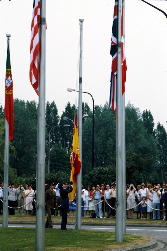 Spain's flag joins those of other NATO nations in front of the NATO headquarters building in at NATO Headquarters in Brussels, Belgium, June 5, 1982, in the ceremonies celebrating Spain's accession to NATO.