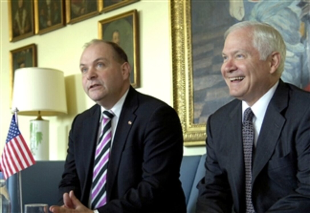 Defense Secretary Robert M. Gates, right, and Danish Minister of Defense Soeren Gade exchange remarks with the media during a joint press conference at the Royal Lifeguard Barracks in Copenhagen, Denmark, April 1, 2008. 