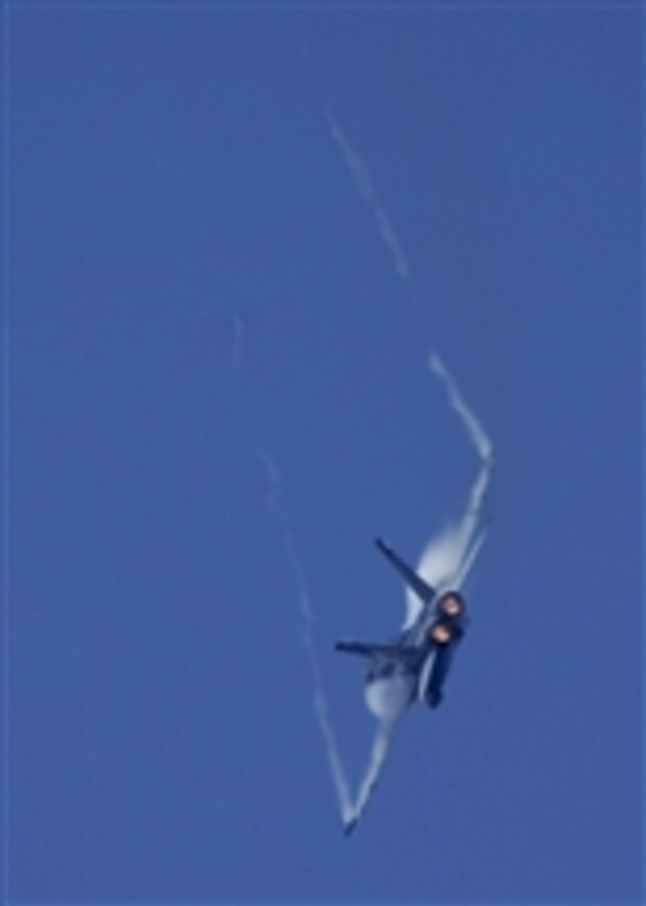 An F/A -18E Super Hornet aircraft performs a high-speed maneuver during an air power demonstration over the Pacific Ocean on March 30, 2008.  The Hornet is attached to Strike Fight Squadron 137 embarked onboard the USS Abraham Lincoln (CVN 72) which is under way to the 5th Fleet area of responsibility.  