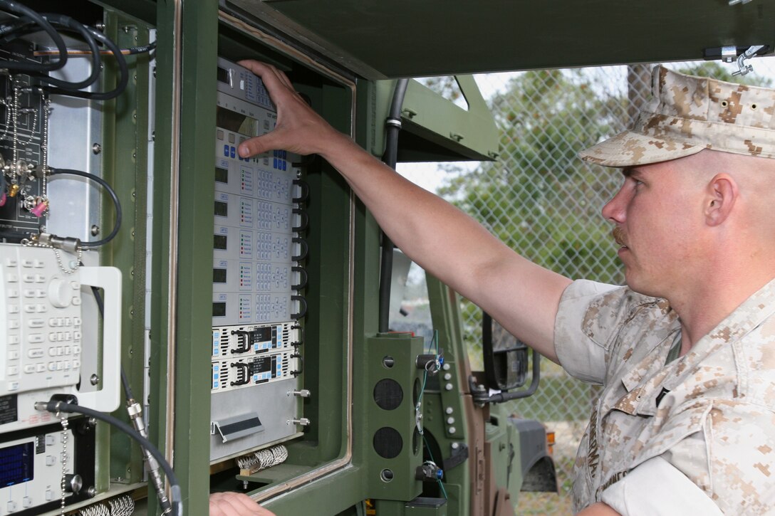 Staff Sgt. Matthew Opperman, with Service Company, 8th Communications Battalion, II Marine Expeditionary Force, works with a Phoenix satellite terminal during Phoenix course practical application for the section here March 10 to April 11.  The Phoenix, which is much lighter and more mobile than the older satellite terminals, is the Marine Corps’ newest satellite system.